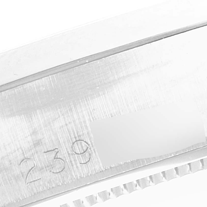 The image shows a close-up of the side of the case of a Rolex Vintage Collection 6694 Men
s Stainless Steel Silver Dial 6694 Men
s Stainless Steel Silver Dial model, highlighting its serial number.