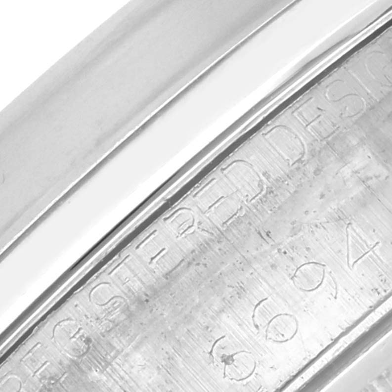 The image shows an angled view of the engraved caseback of the Rolex Vintage Collection 6694 Men's Stainless Steel Silver Dial 6694 Men's Stainless Steel Silver Dial watch.