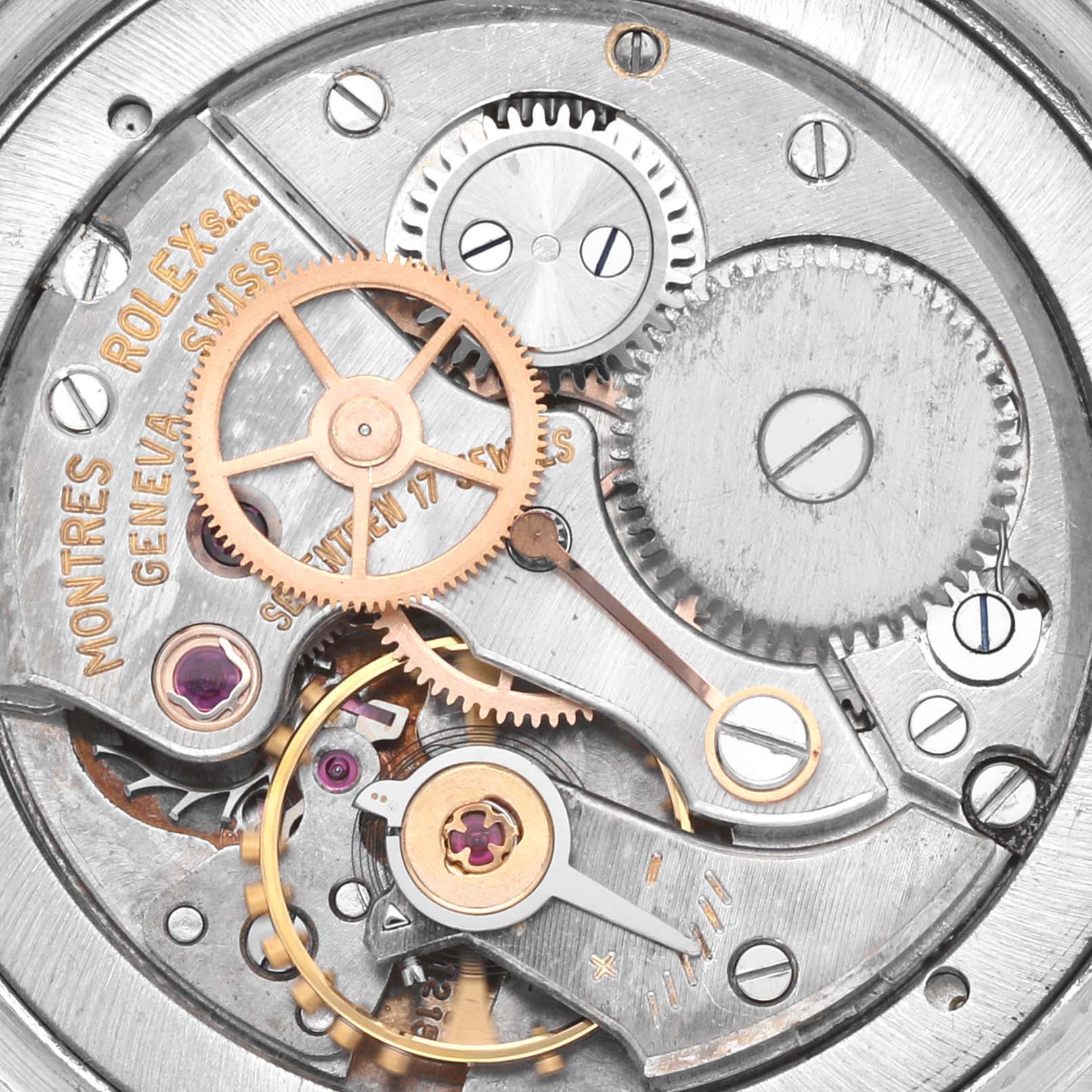 The image shows an up-close view of the internal mechanism of a Rolex Vintage Collection 6694 Men's Stainless Steel Silver Dial 6694 Men's Stainless Steel Silver Dial watch, highlighting gears and components.