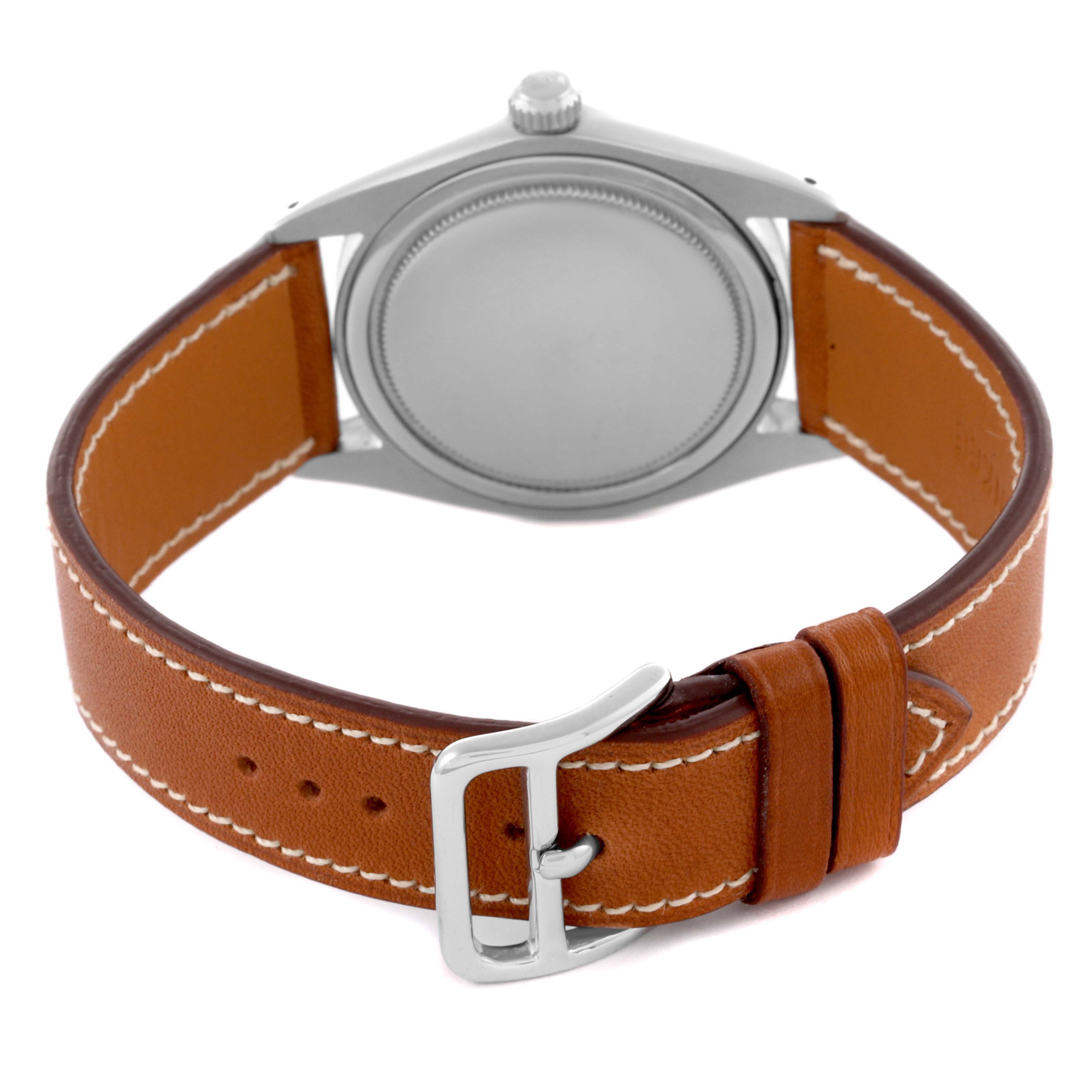 The Rolex Vintage Collection 6694 Men's Stainless Steel Silver Dial 6694 Men's Stainless Steel Silver Dial watch is shown from the back, highlighting the case back and brown leather strap with a buckle.