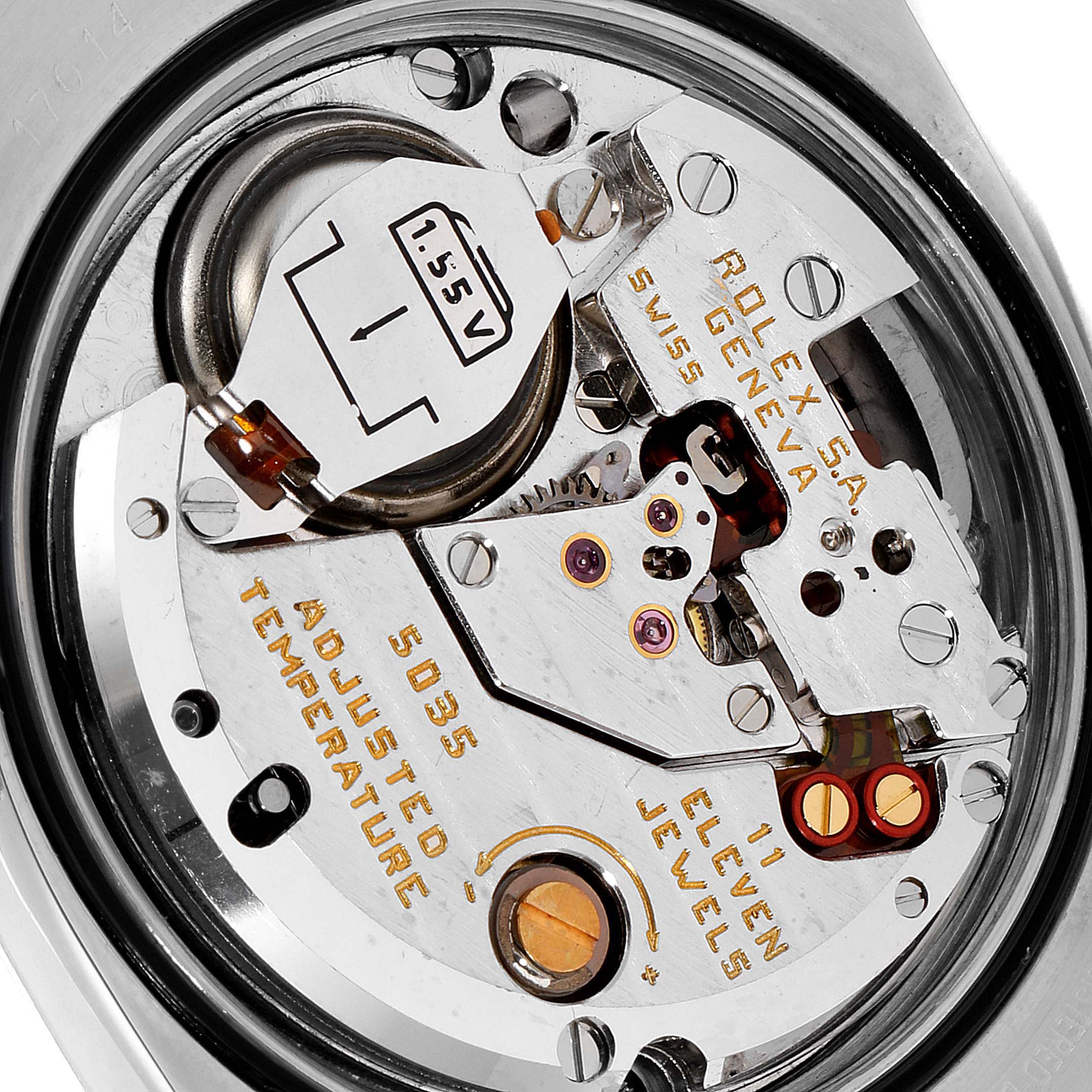 This image shows an internal view of the Rolex Oysterquartz 19601 Men's Stainless Steel Silver Dial 19601 Men's Stainless Steel Silver Dial watch, highlighting its quartz movement and battery.