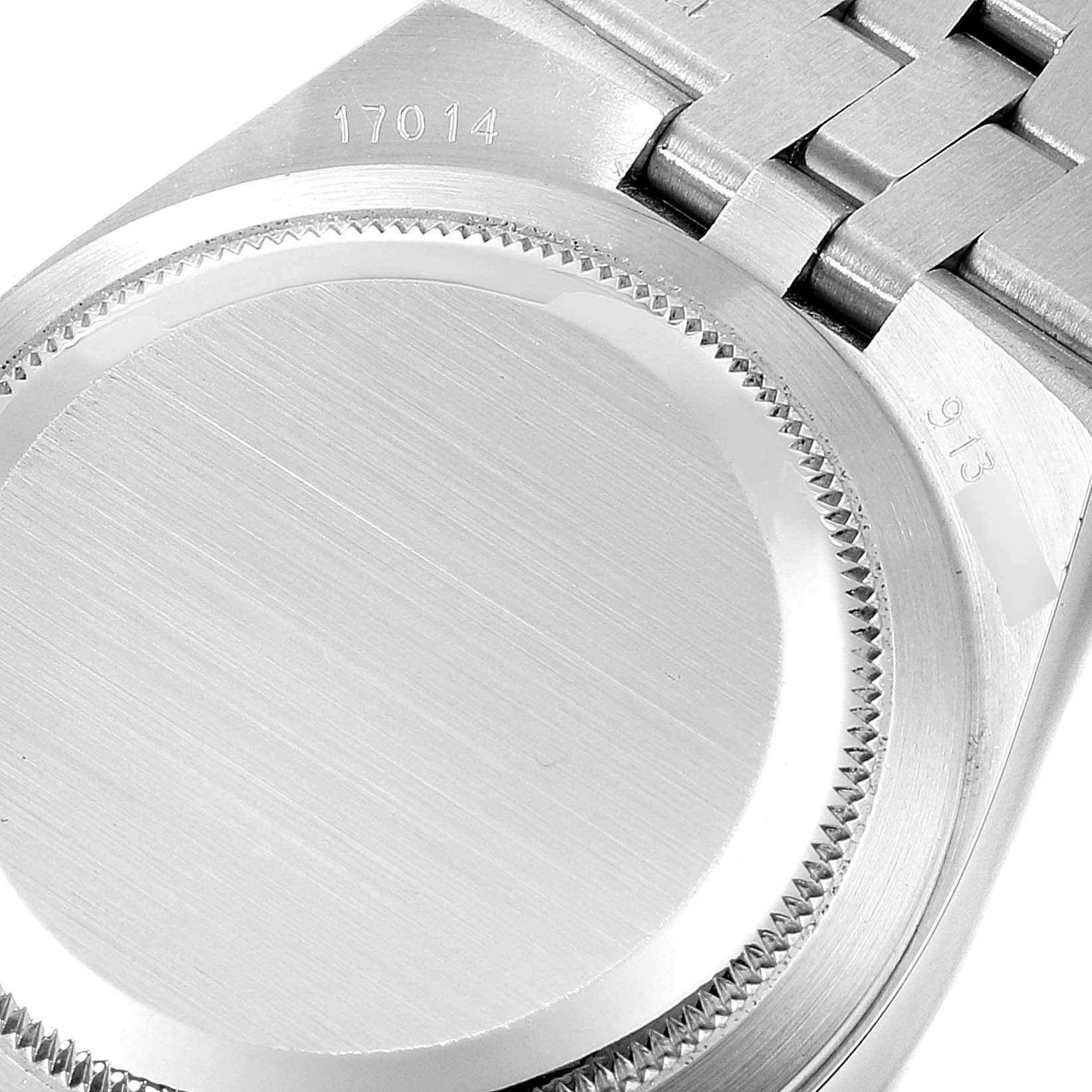This image shows the back case and part of the bracelet of a Rolex Oysterquartz 19601 Men's Stainless Steel Silver Dial 19601 Men's Stainless Steel Silver Dial model watch.
