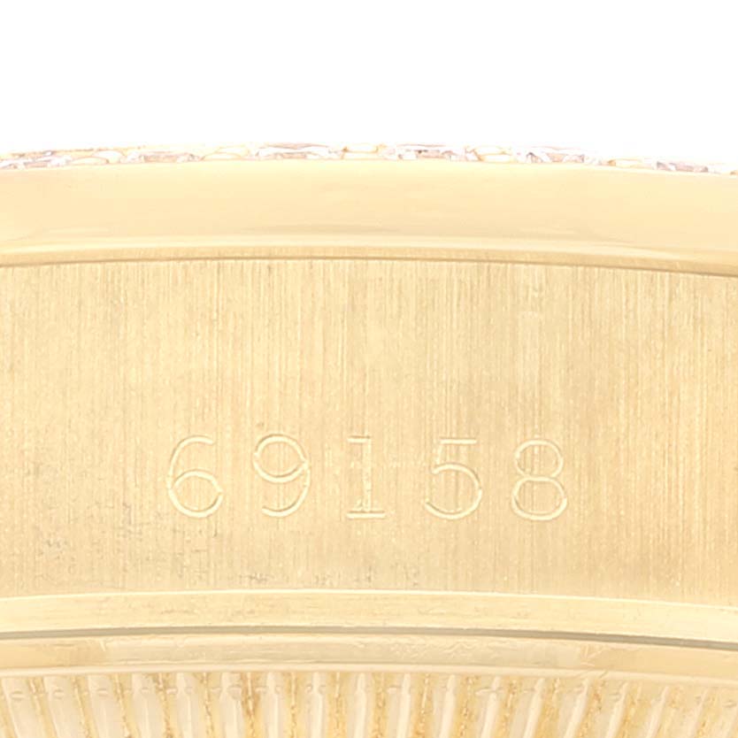 The image shows a close-up view of the edge and engraved model number "69158" of the Rolex President 69158 Women's Yellow Gold Champagne Dial 69158 Women's Yellow Gold Champagne Dial watch.