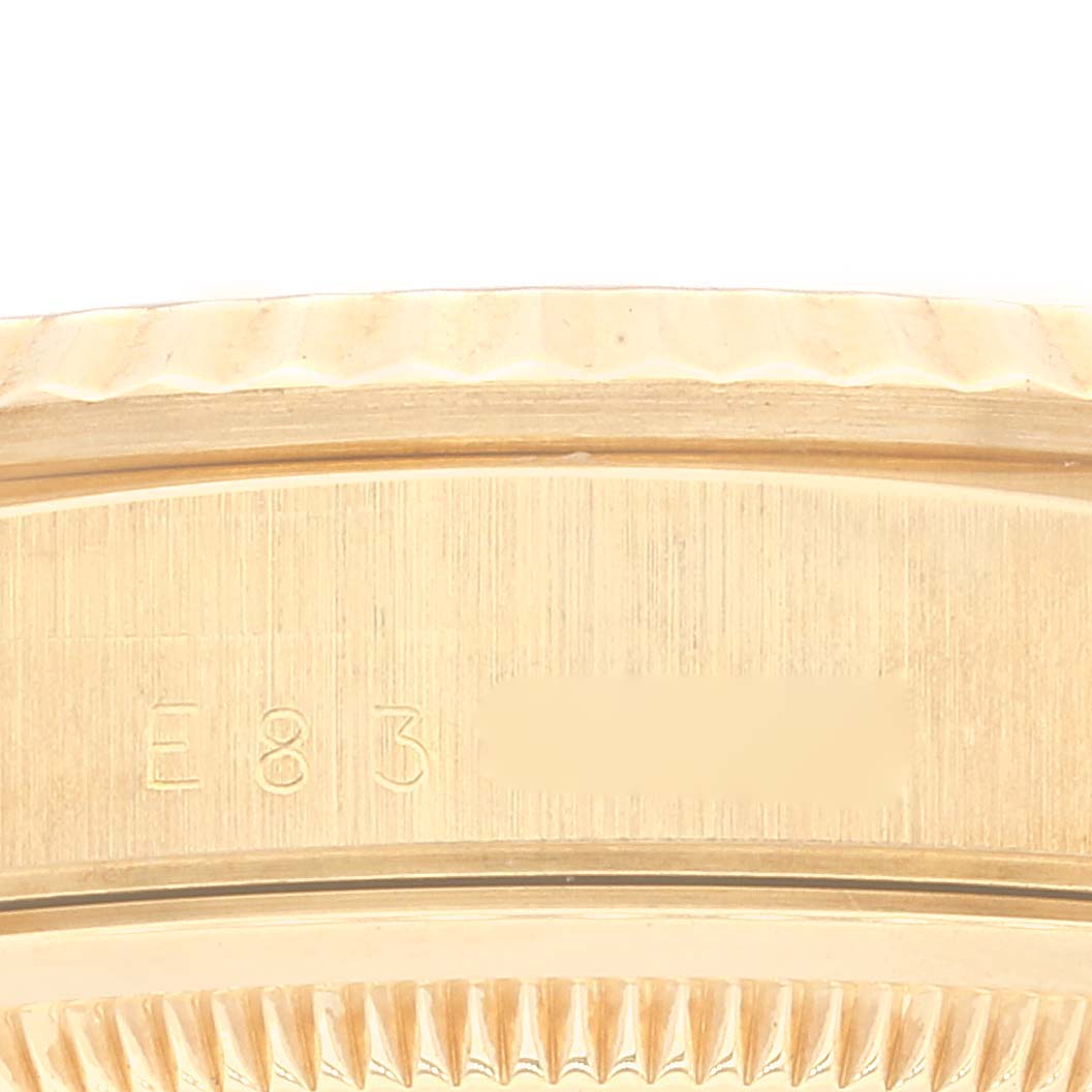 This close-up image shows the serial number engraving on the case back of a Rolex President 18238 Men
s Yellow Gold Champagne Dial 18238 Men
s Yellow Gold Champagne Dial model watch.