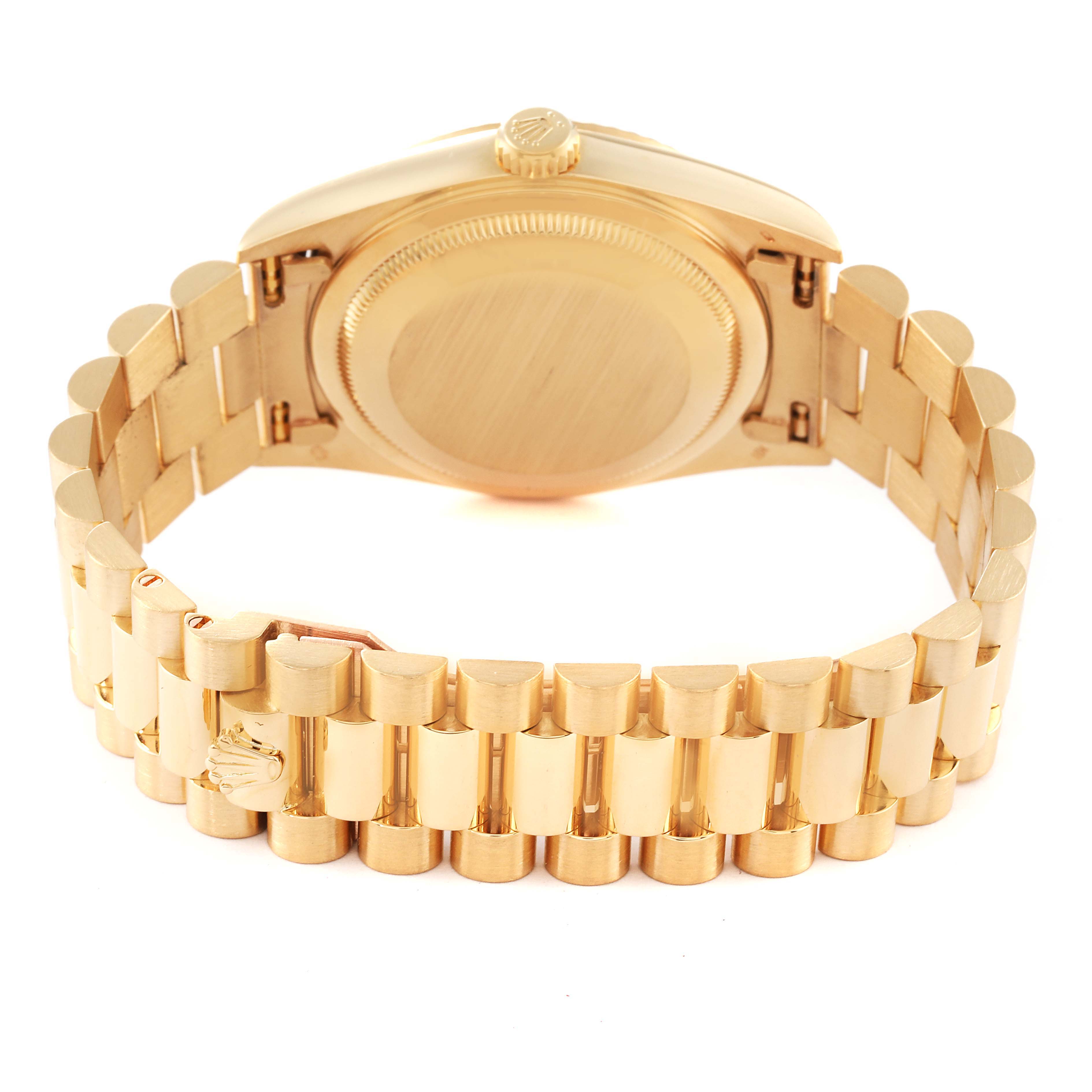 The image shows the back case and bracelet of the Rolex President 18238 Men
s Yellow Gold White Dial 18238 Men
s Yellow Gold White Dial model watch at an angle.