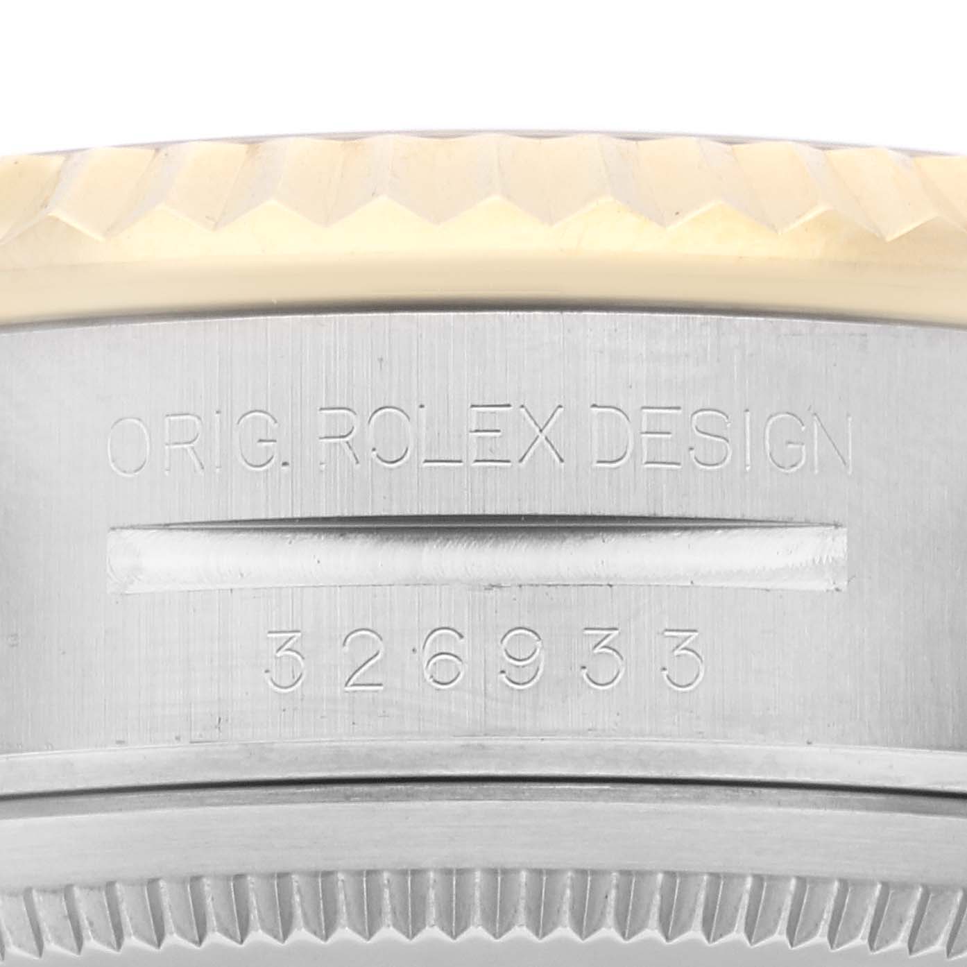 This close-up image shows the engraved caseback of a Rolex Sky-Dweller 326933 Men's Steel and Gold (two tone) Black Dial 326933 Men's Steel and Gold (two tone) Black Dial, displaying the model number and design engraving.