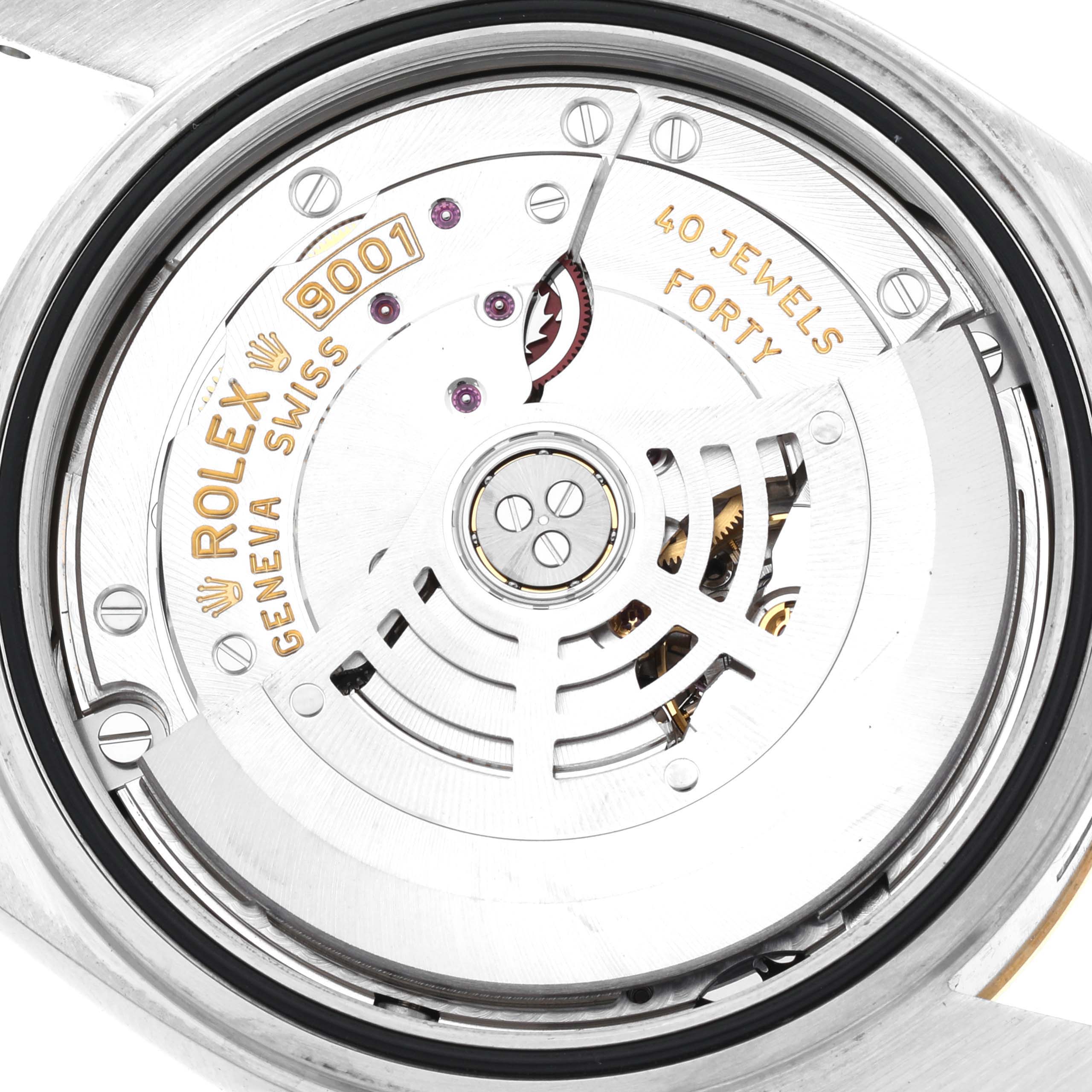 The image shows the internal movement of a Rolex Sky-Dweller 326933 Men's Steel and Gold (two tone) Black Dial 326933 Men's Steel and Gold (two tone) Black Dial, highlighting its rotor and mechanism, marked "9001" and "40 Jewels."