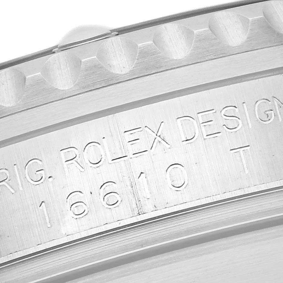 The image shows a close-up of the side of a Rolex Submariner 16610 T Men's Stainless Steel Black Dial 16610 T Men's Stainless Steel Black Dial, focusing on the engraved model and brand details.