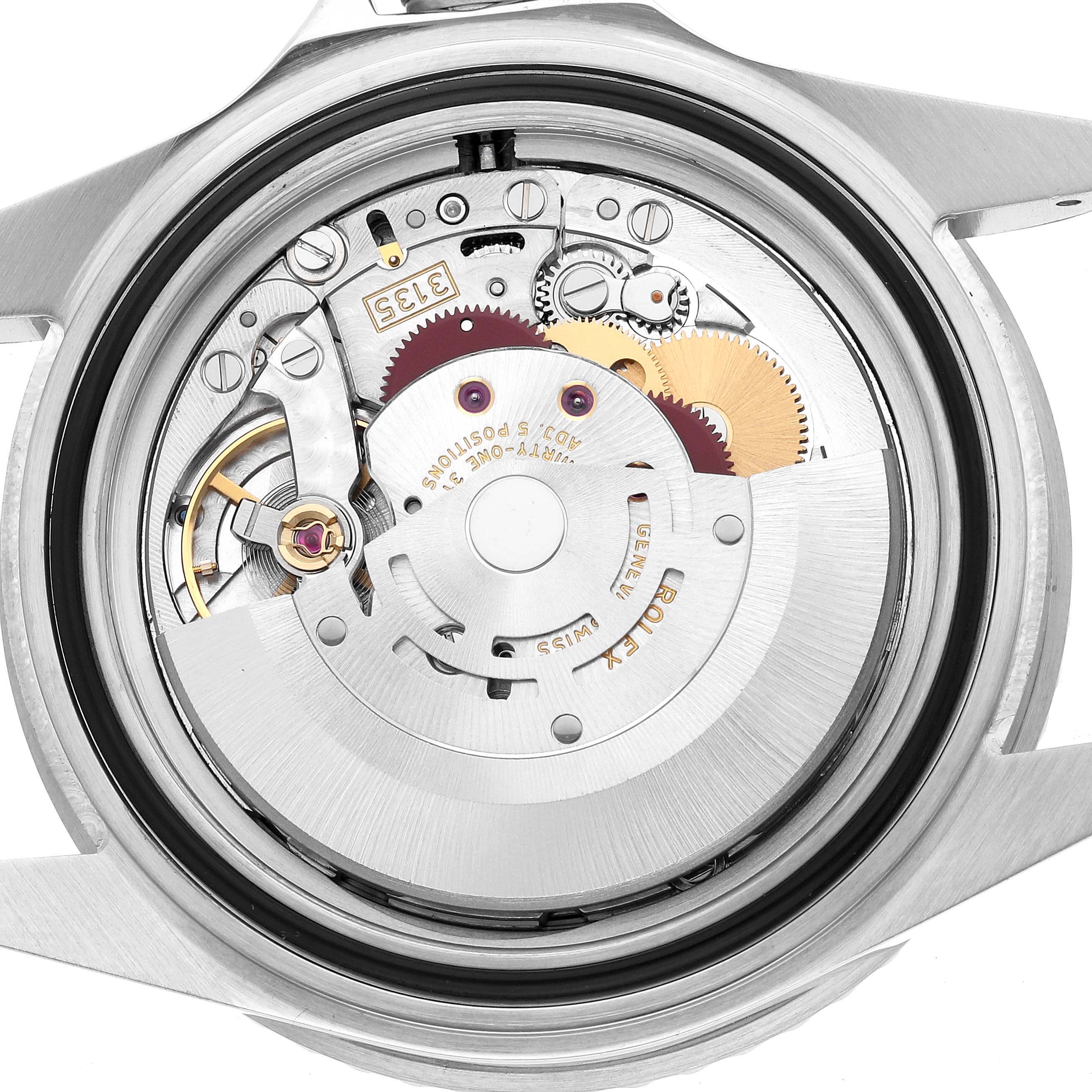 The image shows the movement of a Rolex Submariner 16610 Men's Stainless Steel Black Dial watch from the back, revealing its mechanical parts.