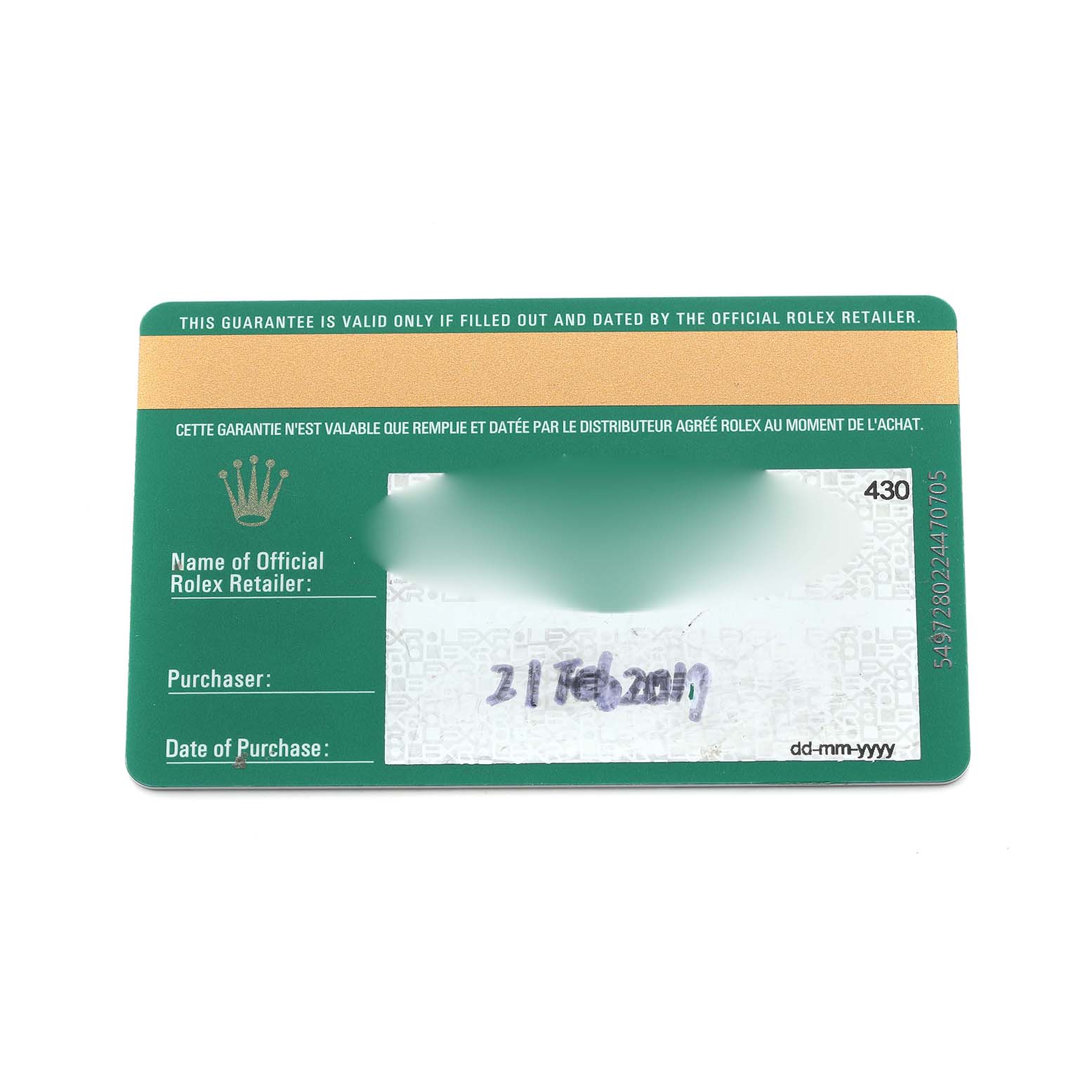 This image shows a Rolex guarantee card for the Submariner model, with retailer and purchase details visible.