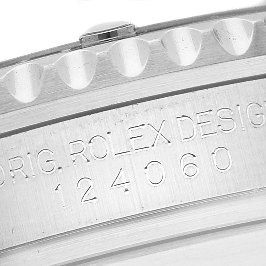 The image shows a close-up of the Rolex Submariner 124060 Men
s Stainless Steel Black Dial 124060 Men
s Stainless Steel Black Dial model, focusing on the side engraving and part of the bezel.