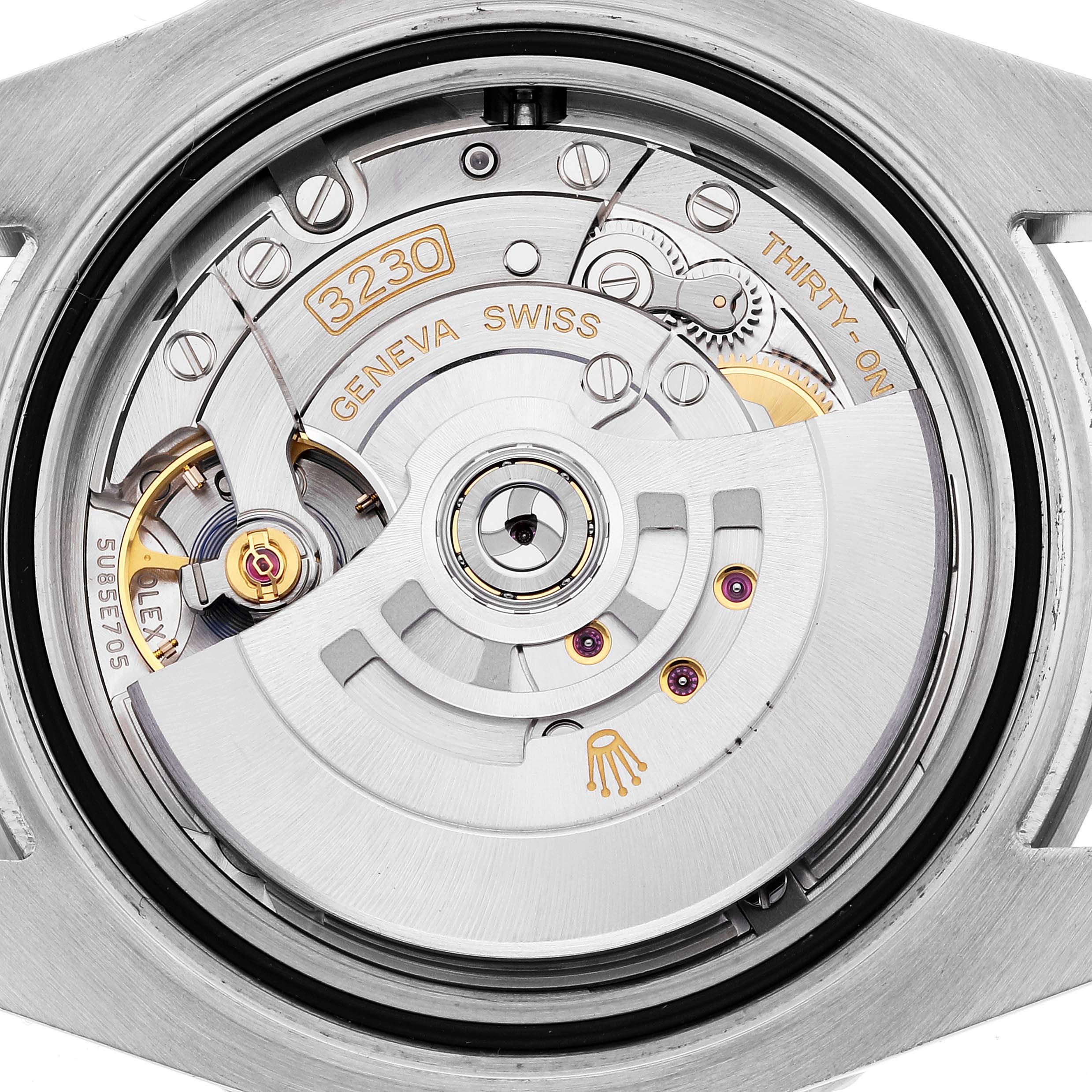 This image shows the intricate movement and internal mechanism of the Submariner model by Rolex, including the rotor and gears.