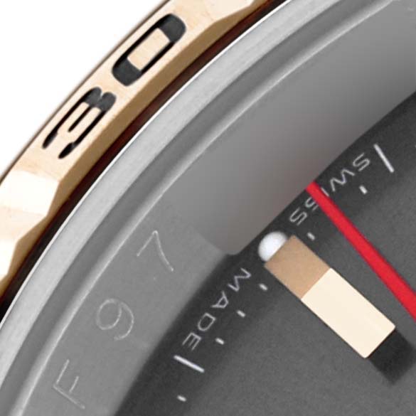 The image shows a close-up angle of the bezel and edge of the dial from a Rolex Turn-o-Graph 116263 Men's Steel and Gold (two tone) Grey Dial 116263 Men's Steel and Gold (two tone) Grey Dial watch.
