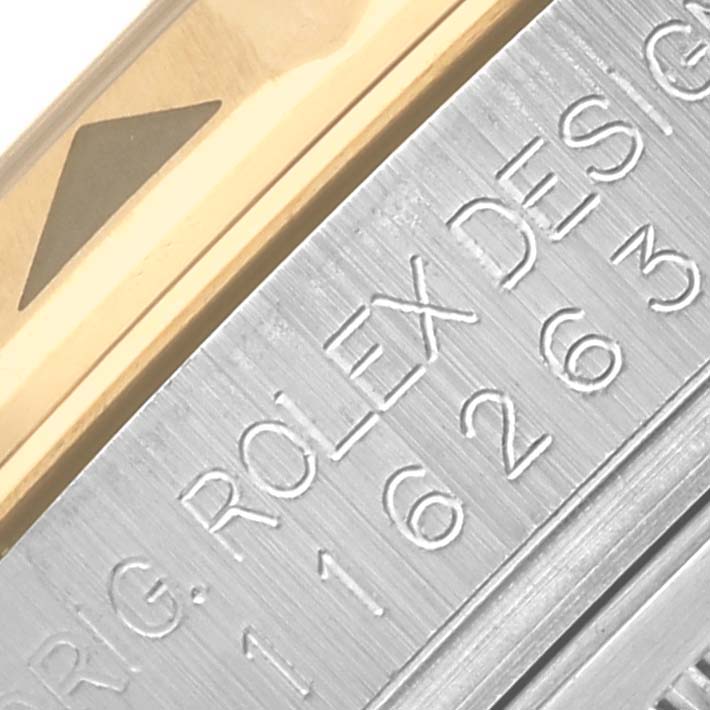 The image shows a close-up of the Rolex Turn-o-Graph 116263 Men's Steel and Gold (two tone) Grey Dial 116263 Men's Steel and Gold (two tone) Grey Dial's gold bezel and engraved side with model details.