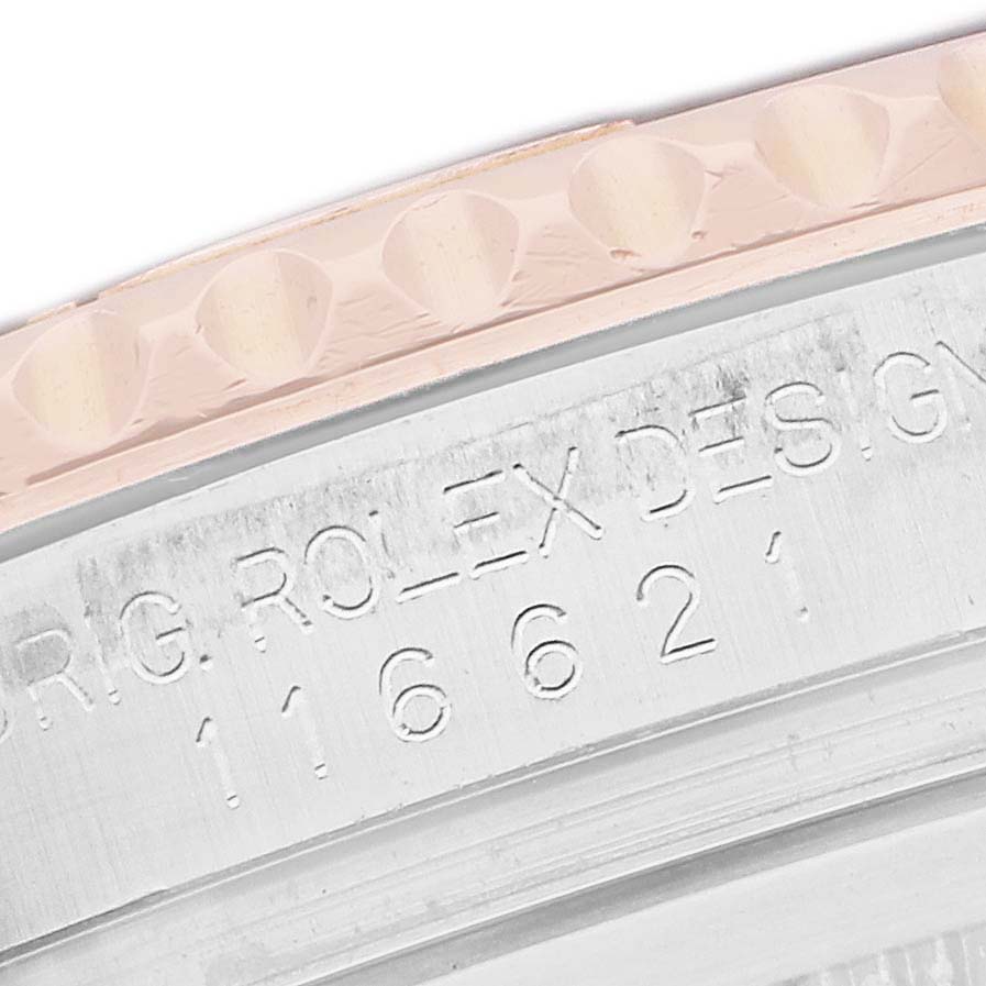 The image shows a close-up of the Rolex Yacht-Master 116621 Men's Steel and Gold (two tone) Brown Dial watch, focusing on the engraved inner bezel and part of the outer bezel.