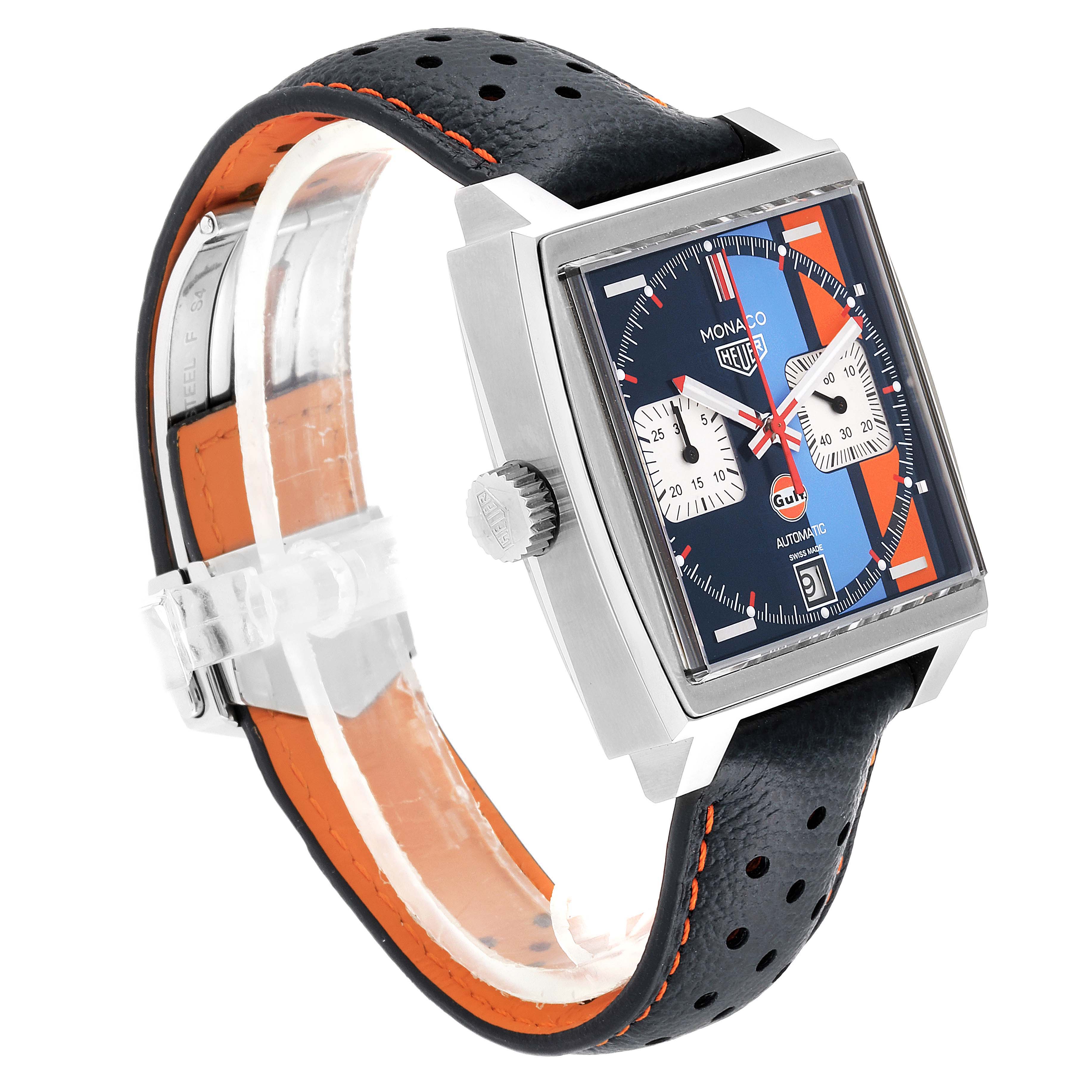 The image shows a side view of the Tag Heuer Monaco CAW211R.FC6401 Men's Stainless Steel Blue Dial CAW211R.FC6401 Men's Stainless Steel Blue Dial watch, highlighting its square dial, crown, and perforated leather strap with orange lining.