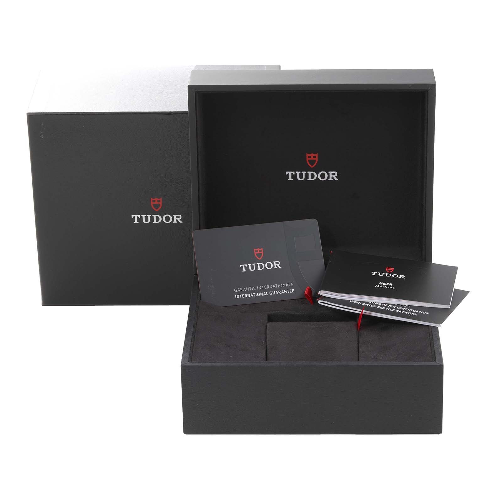The image shows the packaging and accessories, including warranty and user manual, for the Tudor Heritage Black Bay 79010SG Men
s Stainless Steel Grey Dial 79010SG Men
s Stainless Steel Grey Dial watch.