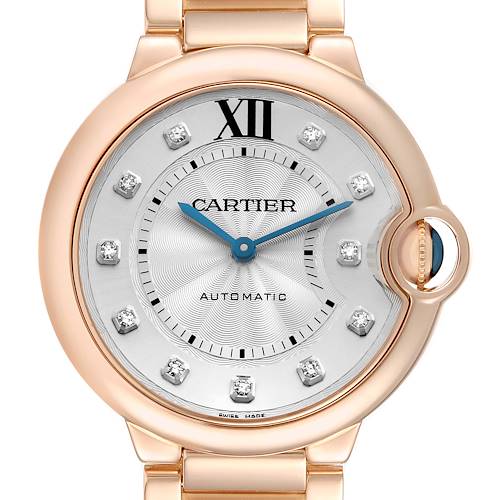 The Ballon Bleu de Cartier watch is shown from a front angle, featuring its dial and distinctive crown.