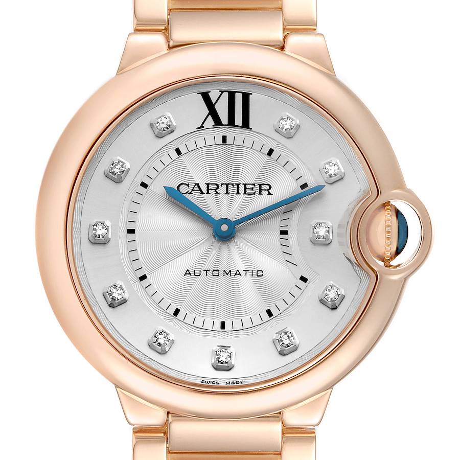 The Cartier Ballon Bleu WE902026 Women's Rose Gold Silver Dial watch is shown from the front, highlighting its dial, blue hands, and iconic crown.