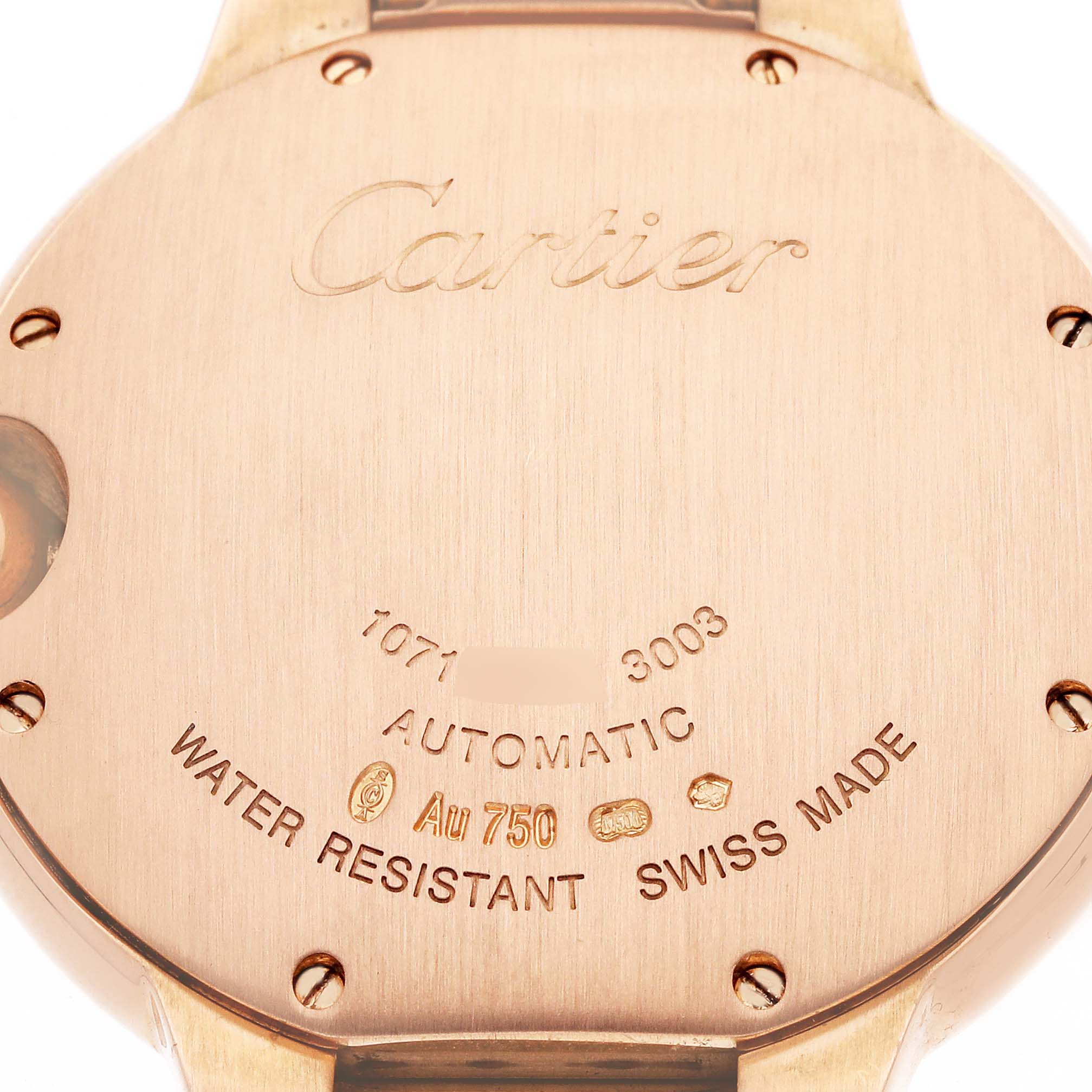 The image shows the back of the Cartier Ballon Bleu WE902026 Women
s Rose Gold Silver Dial watch, featuring engravings and markings about its specifications.