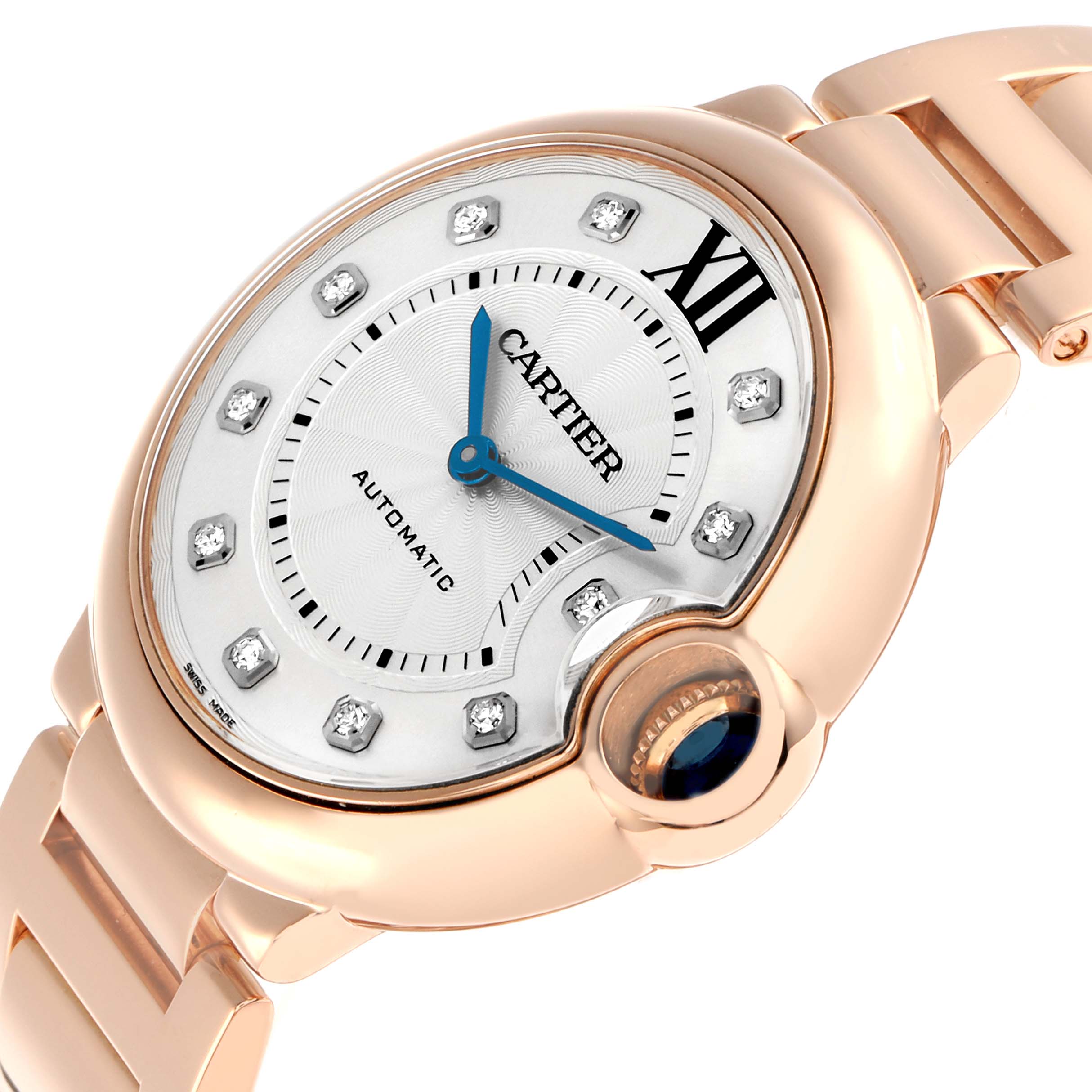 The Cartier Ballon Bleu WE902026 Women
s Rose Gold Silver Dial watch is shown from a close-up angle, highlighting the dial, crown, and part of the bracelet.