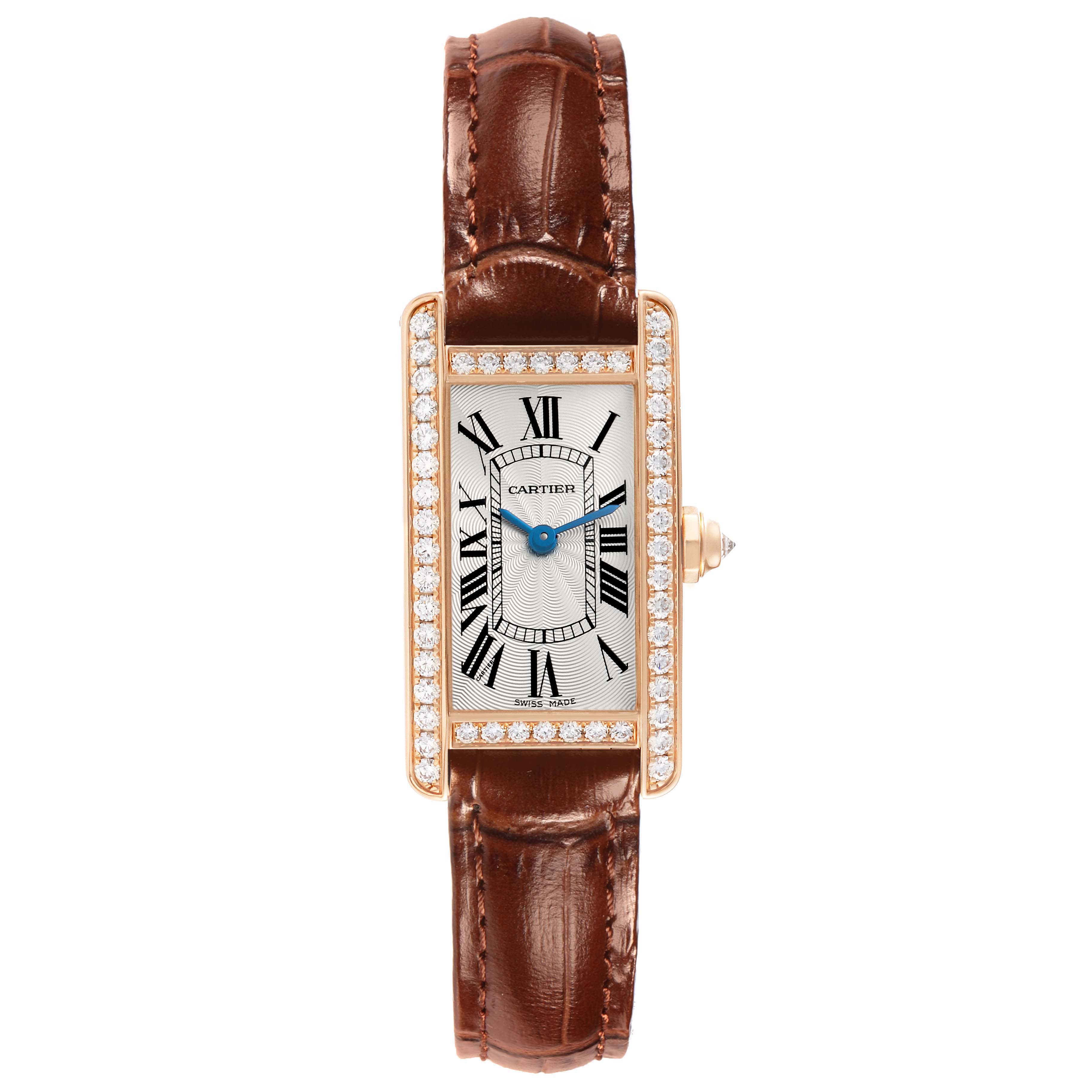 The Cartier Tank Americaine WJTA0002 Women
s Rose Gold Silver Dial watch is shown from a top-down angle, displaying its rectangular face with diamond accents and brown leather strap.