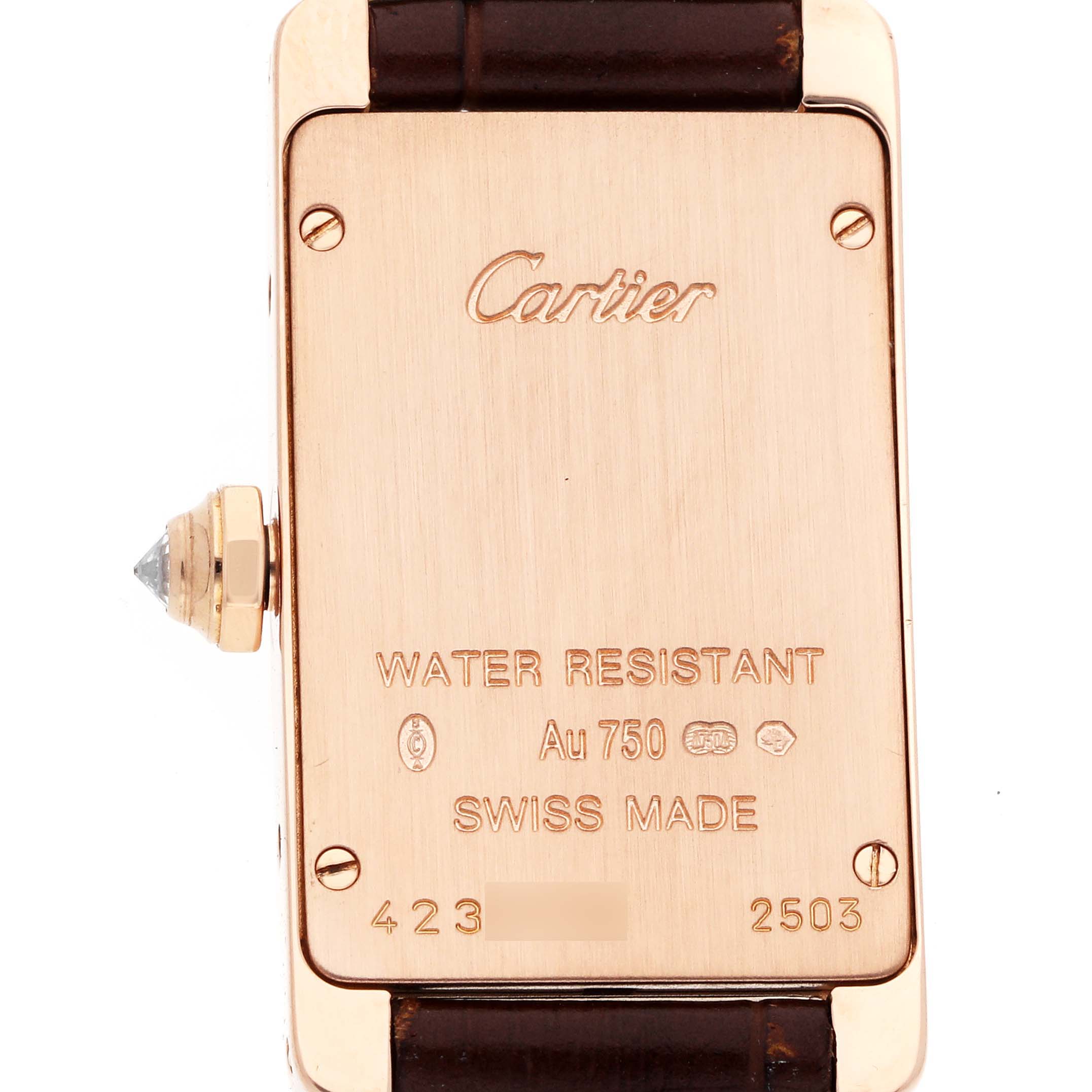 The image shows the back of a Cartier Tank Americaine WJTA0002 Women
s Rose Gold Silver Dial watch, highlighting the case and engravings.