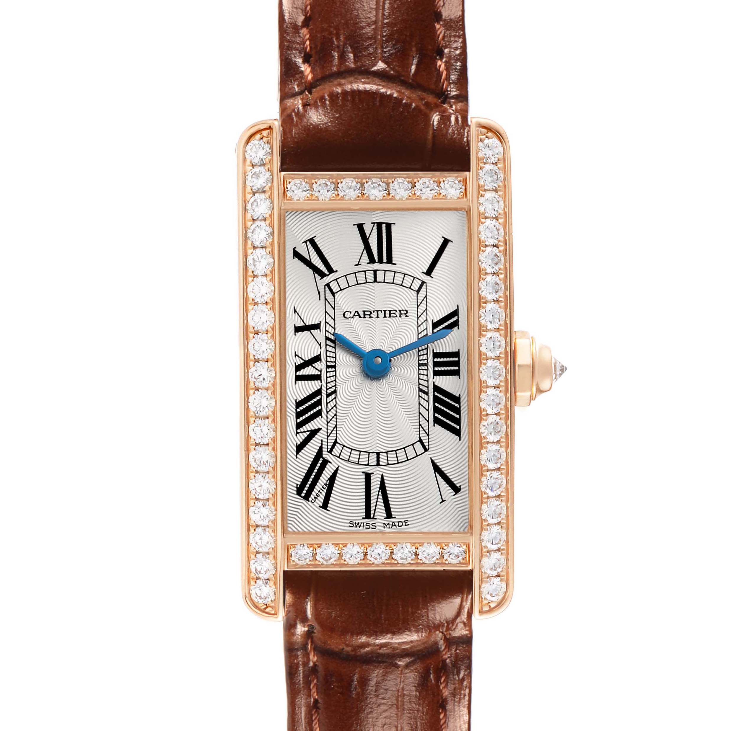 The Cartier Tank Americaine WJTA0002 Women
s Rose Gold Silver Dial watch is shown from a top-down view highlighting its rectangular face with a diamond bezel and brown leather strap.