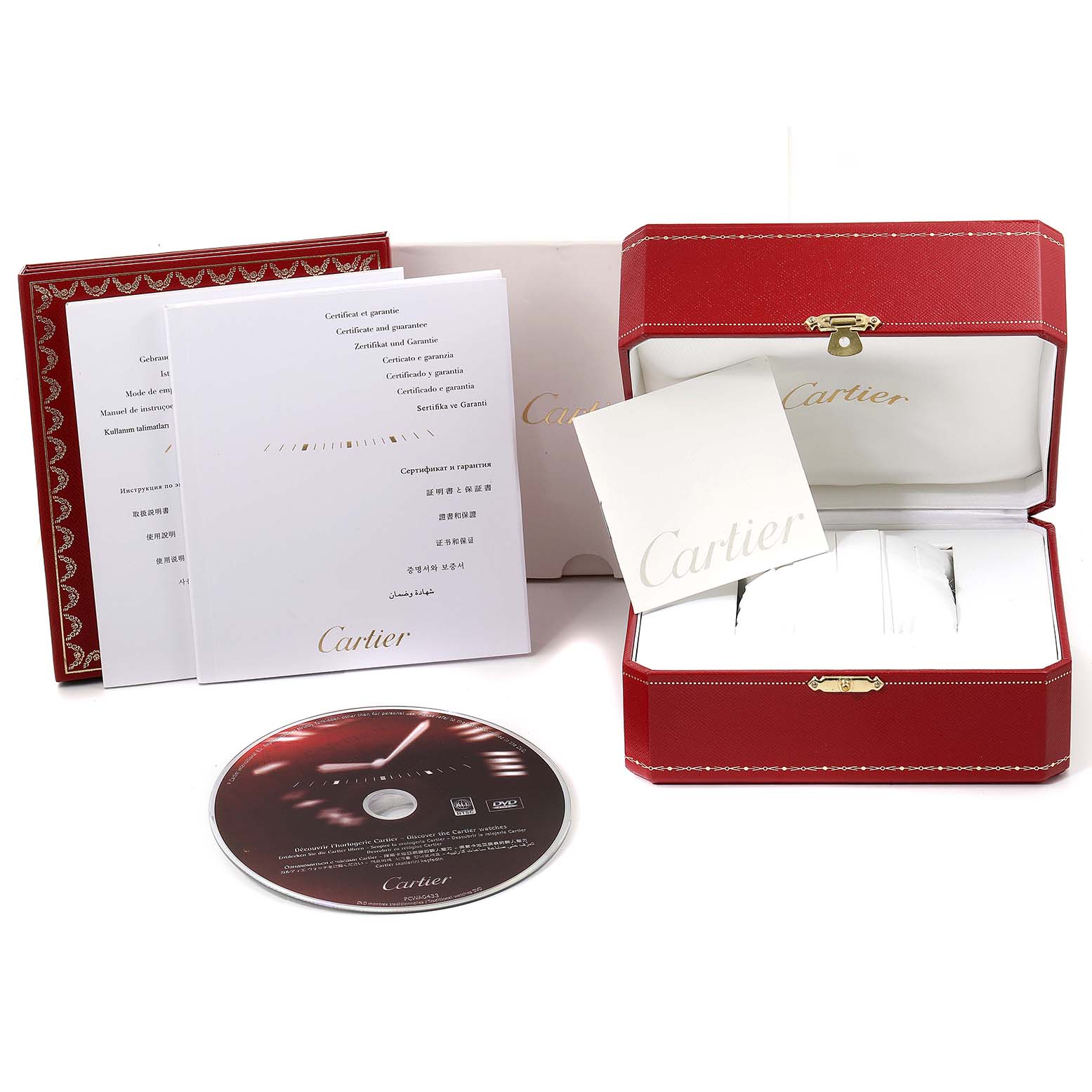 The image shows the packaging, warranty booklets, and accessories of a Cartier Tank Française watch, including a red watch box and a DVD.