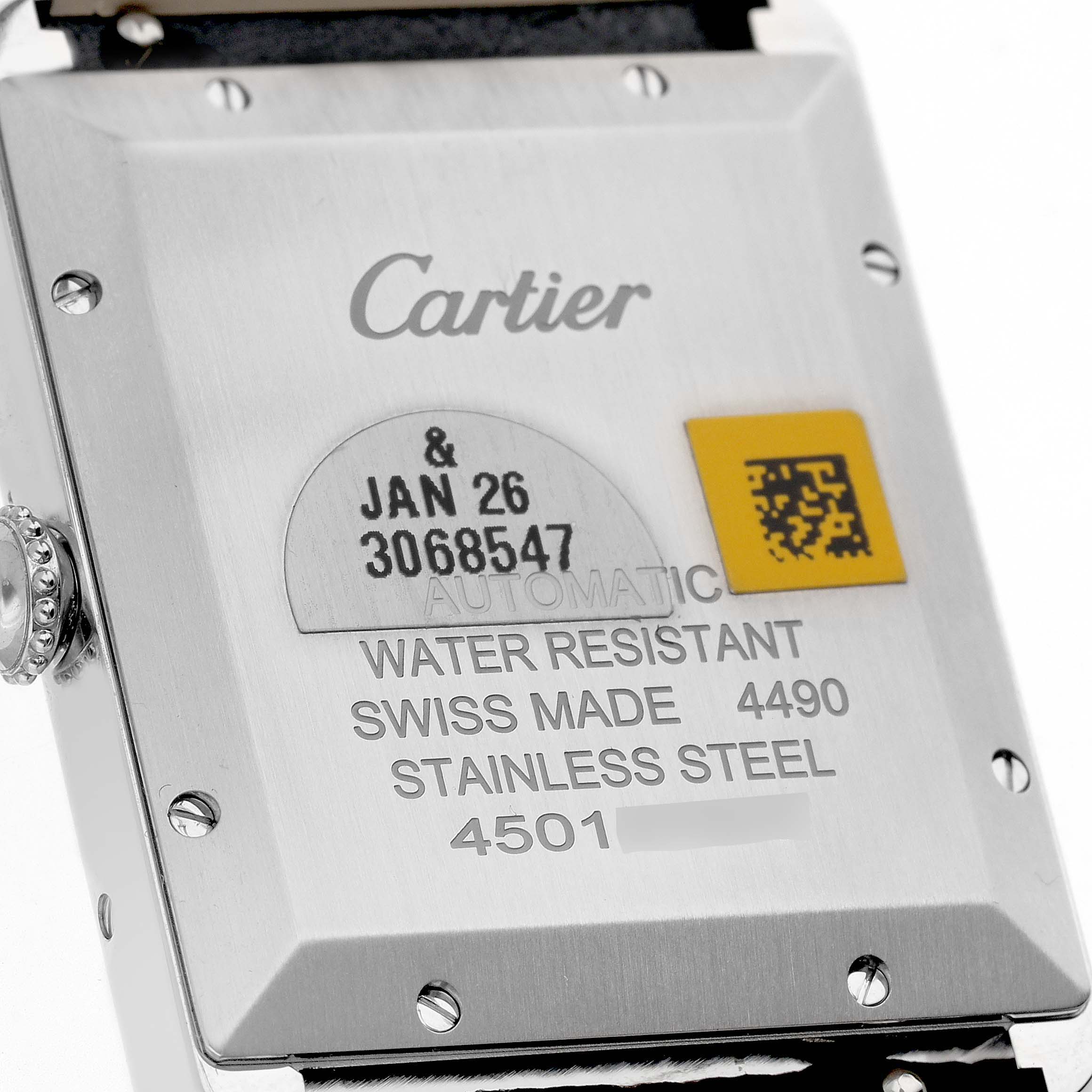 This image shows the back case of a Cartier Tank Must WSTA0040 Men's Stainless Steel Silver Dial WSTA0040 Men's Stainless Steel Silver Dial watch, highlighting the brand marking, water resistance, and serial numbers.