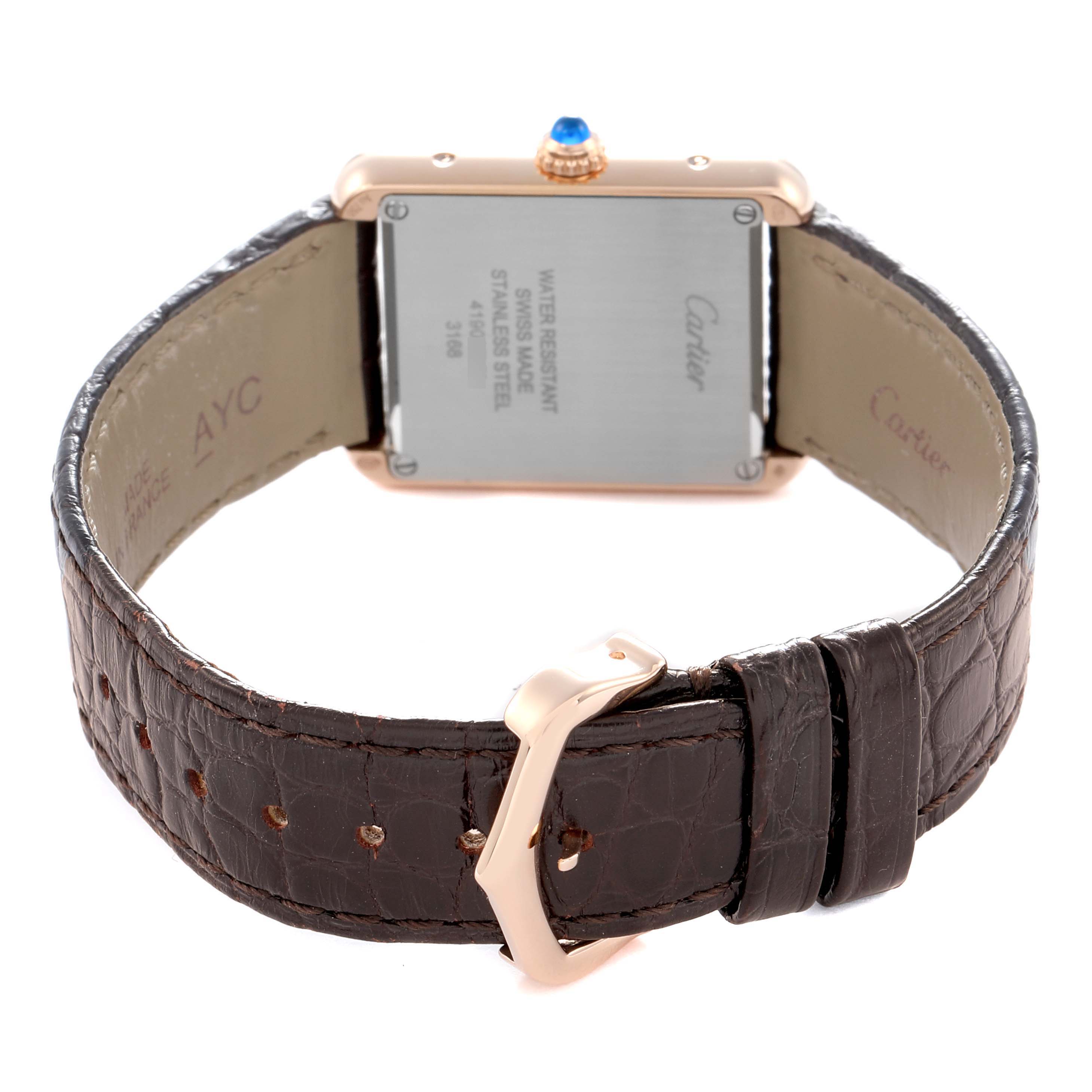 The image shows the back of the Cartier Tank Solo W5200024 Women
s Steel and Gold (two tone) Silver Dial watch, highlighting the case back, crown, and leather strap with buckle.