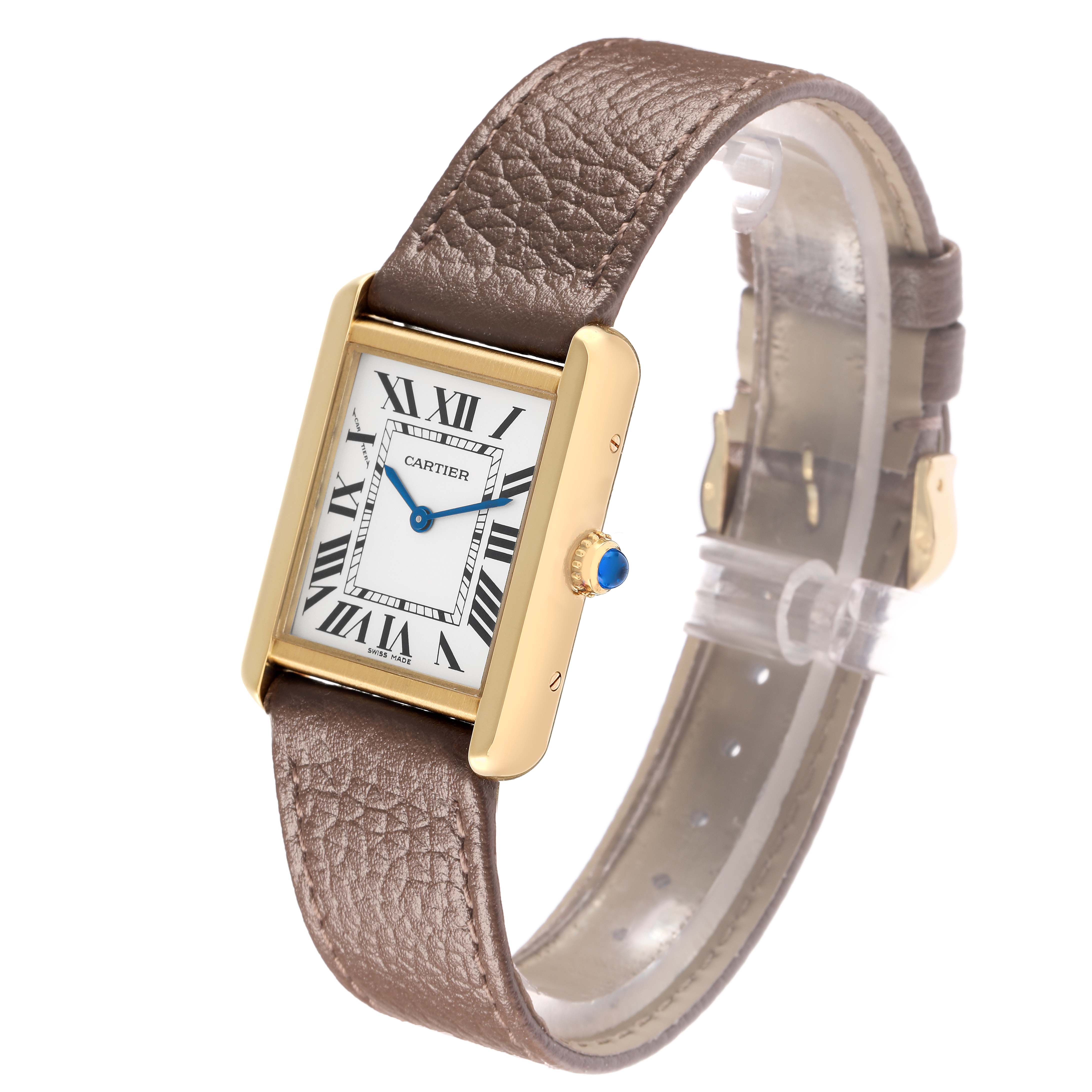 The Cartier Tank Solo W1018755 Women
s Steel and Gold (two tone) Silver Dial watch is shown at an angled view, highlighting the dial, crown, and leather strap.