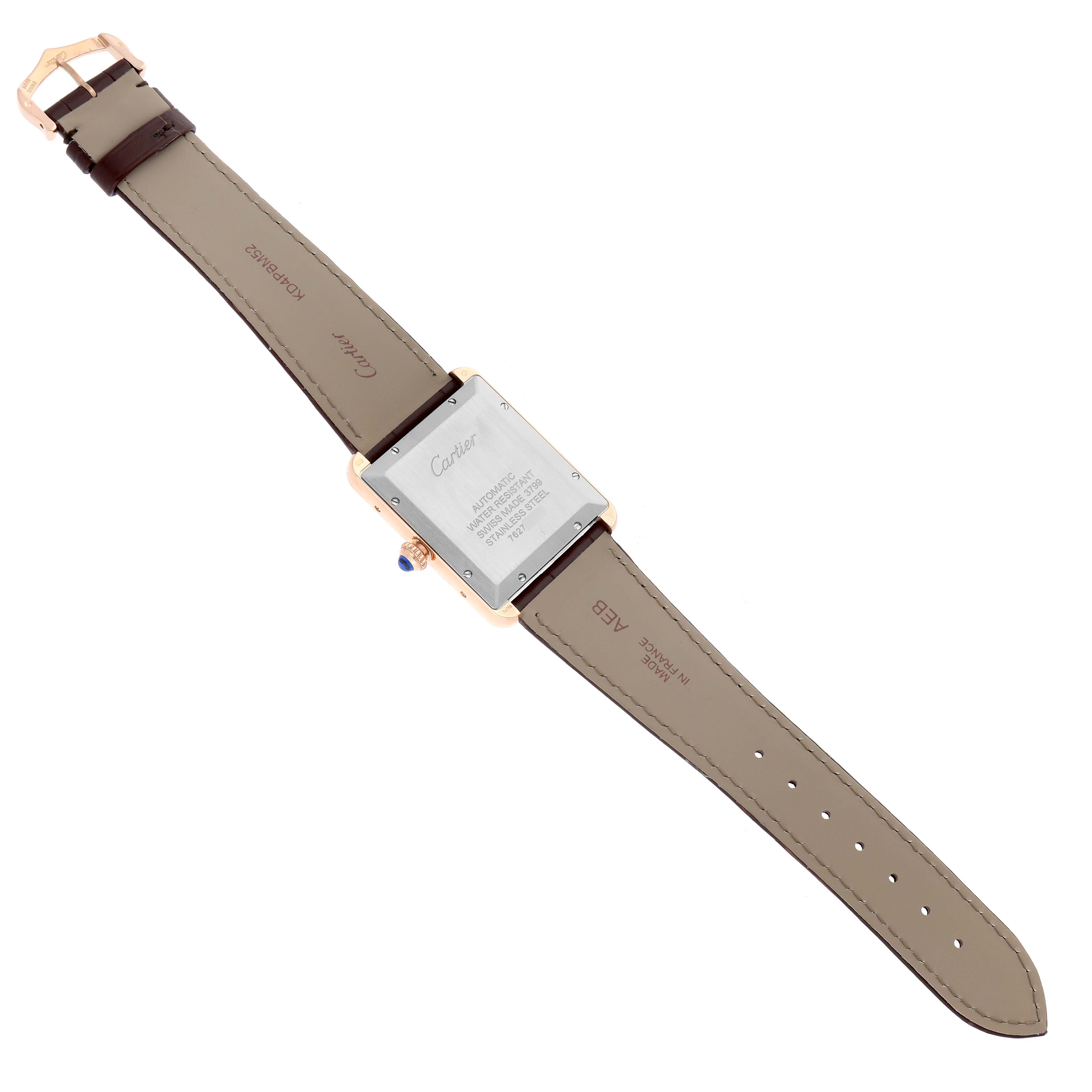 The Cartier Tank Solo W5200026 Men
s Steel and Gold (two tone) Silver Dial watch is shown from the back, revealing the case back, strap, and buckle.