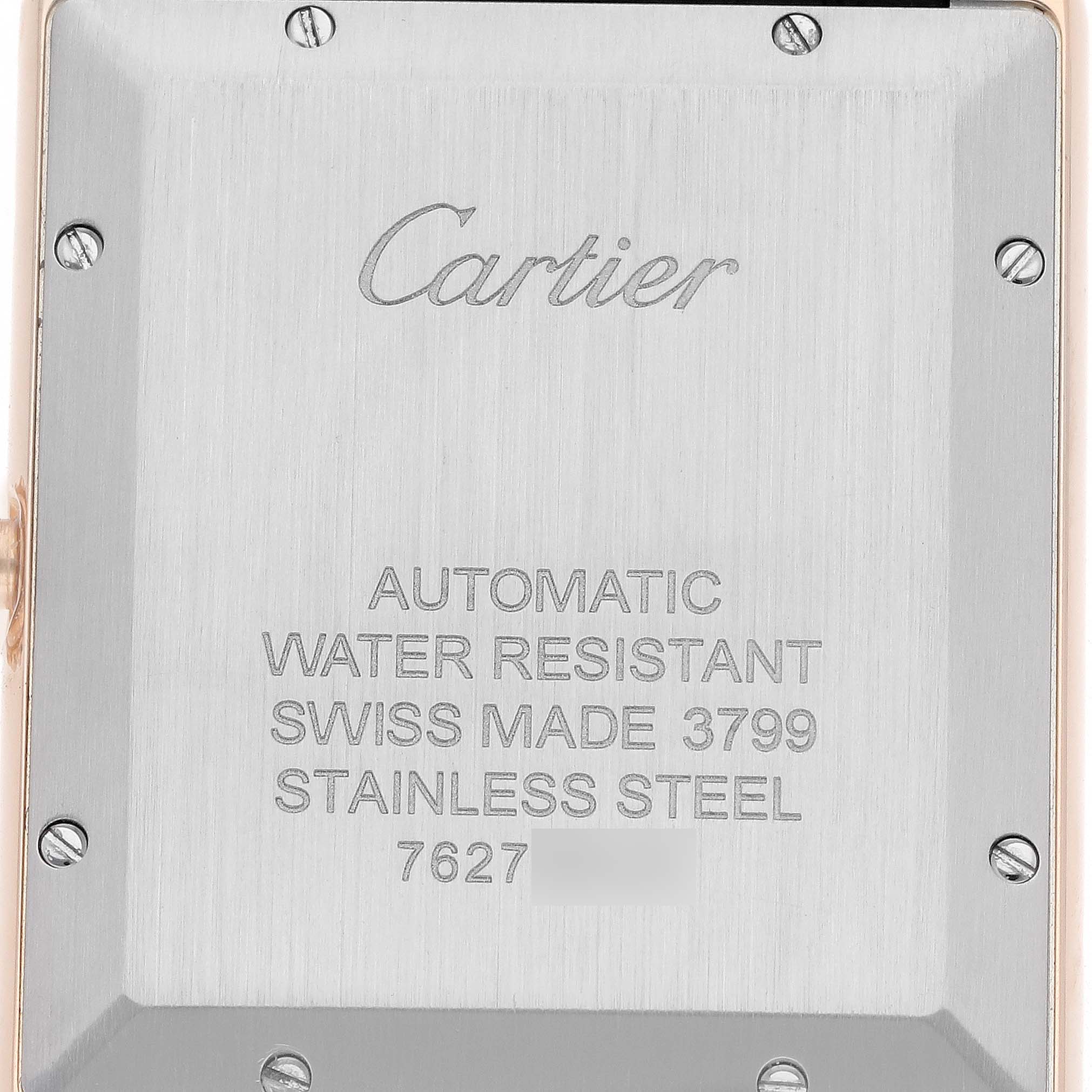 The image shows the back of the Cartier Tank Solo W5200026 Men
s Steel and Gold (two tone) Silver Dial watch, highlighting the engraved details and screws.