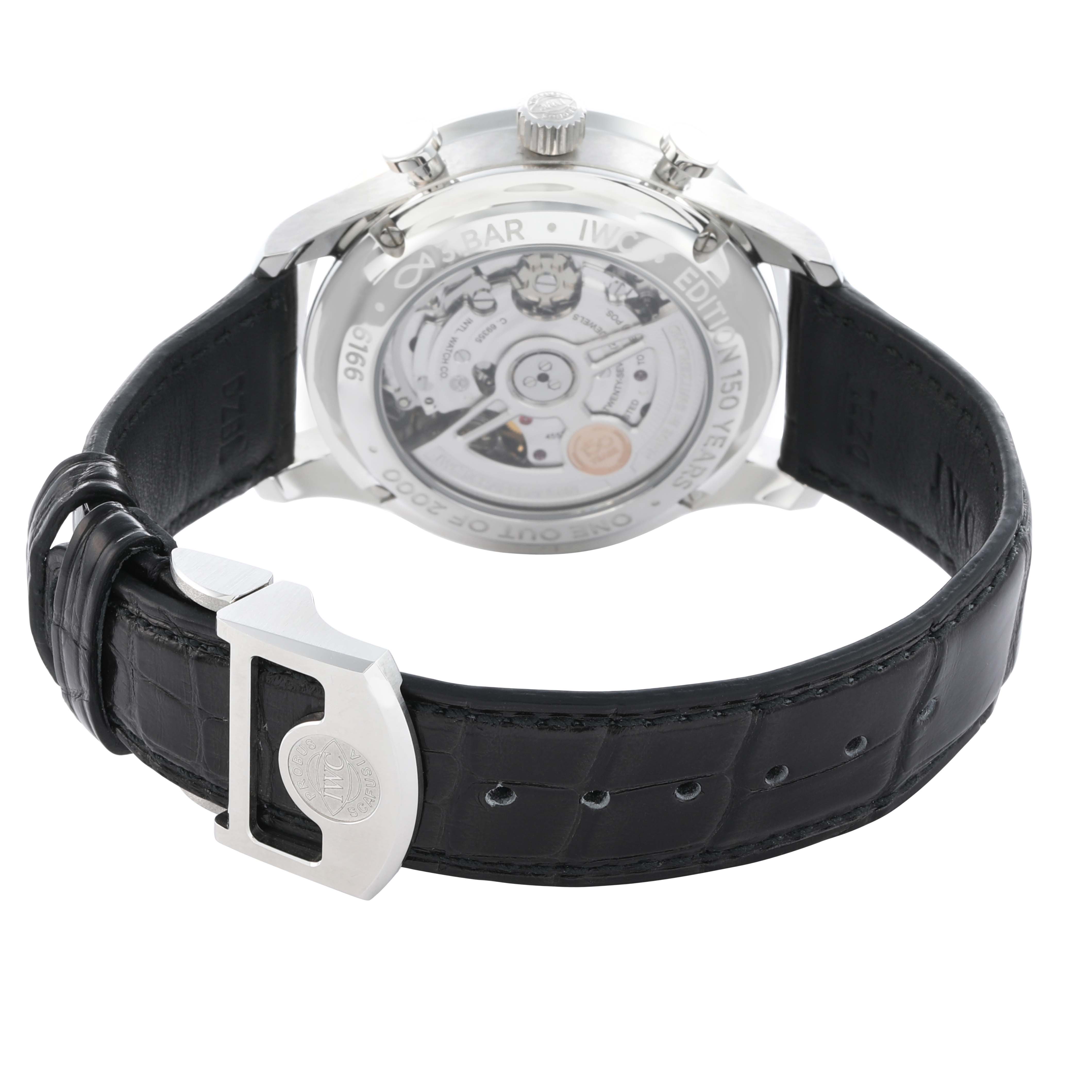 The IWC Portuguese IW371601 Men
s Stainless Steel Blue Dial watch is shown from the back, displaying its movement and leather strap with a clasp.