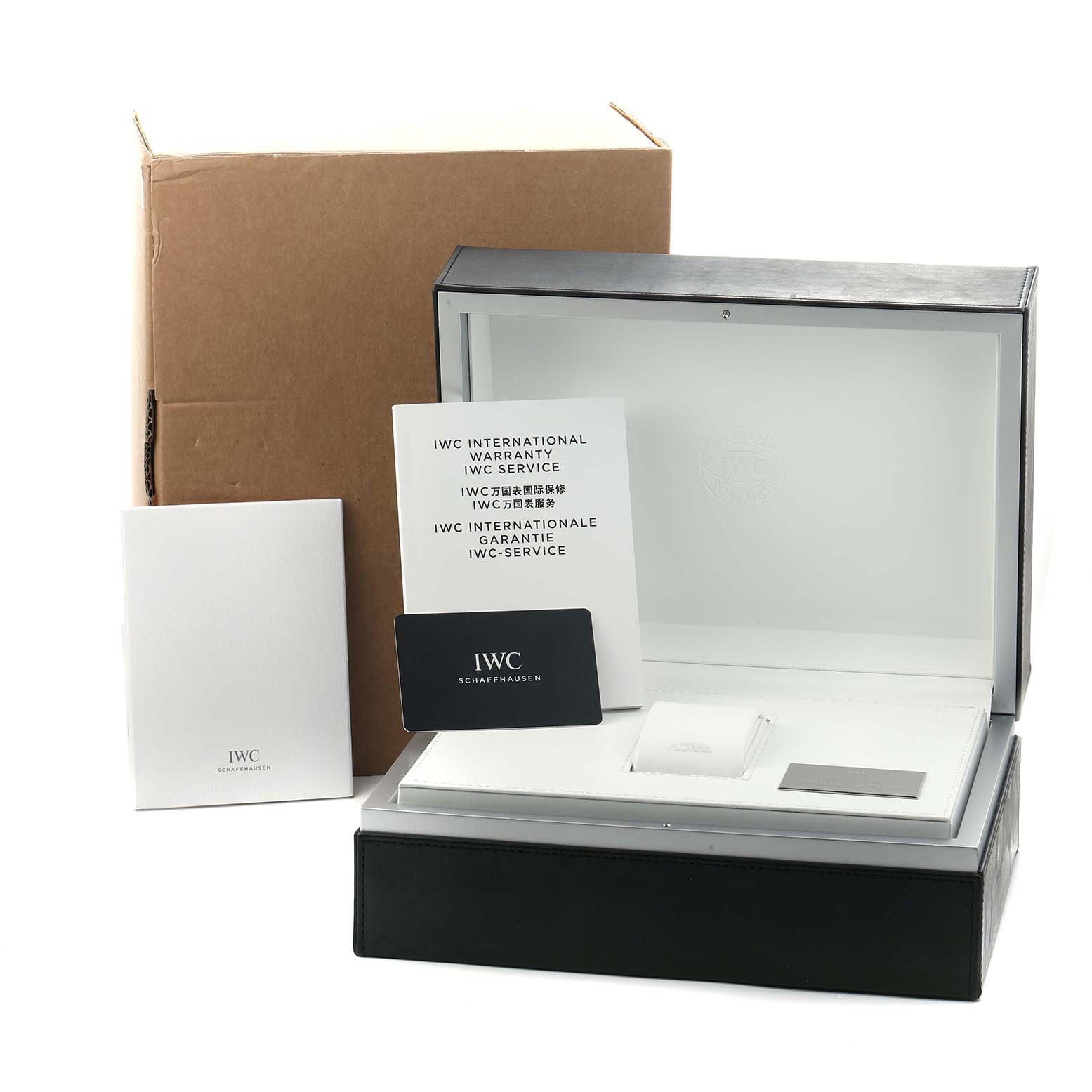 The image shows an open IWC Portuguese IW371601 Men
s Stainless Steel Blue Dial watch box with warranty cards and booklets displayed in front.