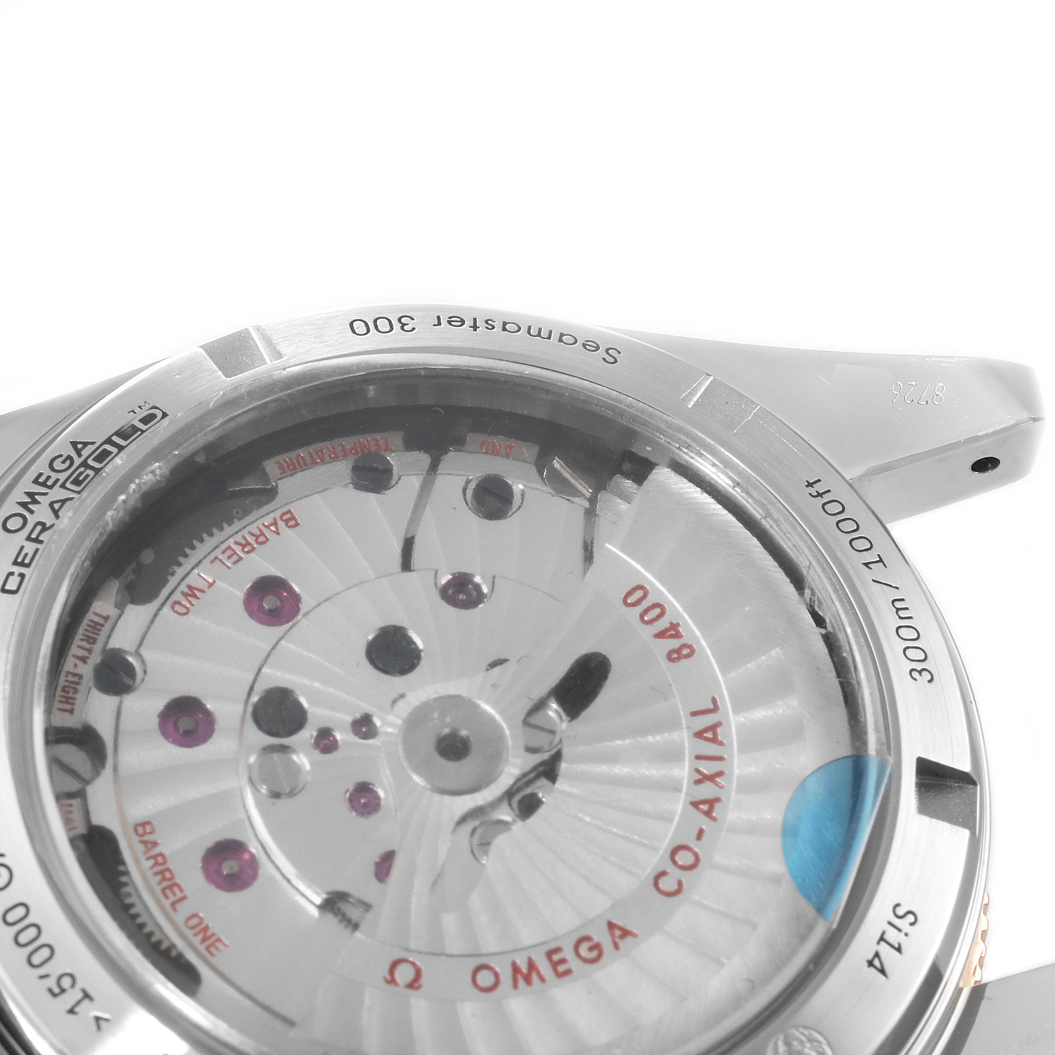 The image shows the back of an Omega Seamaster 233.20.41.21.01.001 Men's Steel and Gold (two tone) Black Dial 233.20.41.21.01.001 Men's Steel and Gold (two tone) Black Dial watch, highlighting its co-axial 8400 movement mechanism through a transparent case back.