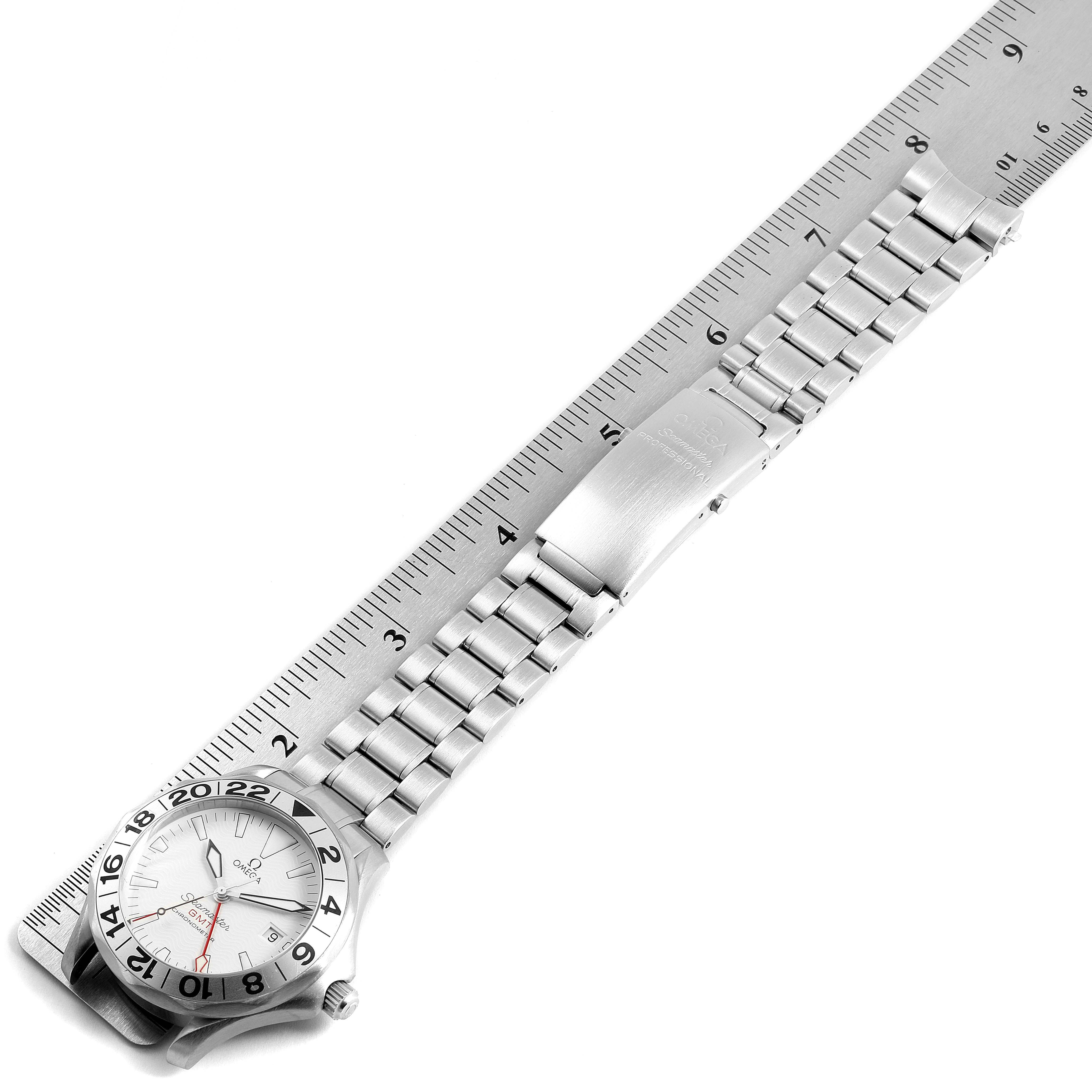The image shows an Omega Seamaster 2538.20.00 Men's Stainless Steel White Dial 2538.20.00 Men's Stainless Steel White Dial watch lying flat, with its stainless steel bracelet and clasp extending alongside a ruler.
