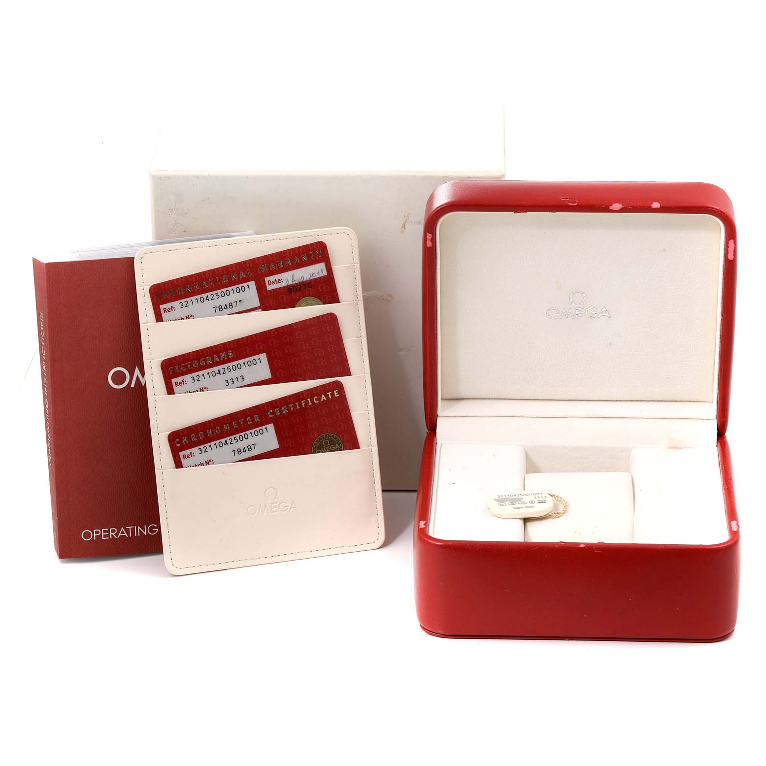 The image shows an Omega Speedmaster 321.10.42.50.01.001 Men
s Stainless Steel Black Dial 321.10.42.50.01.001 Men
s Stainless Steel Black Dial watch box, warranty and certification cards, and an operating manual.