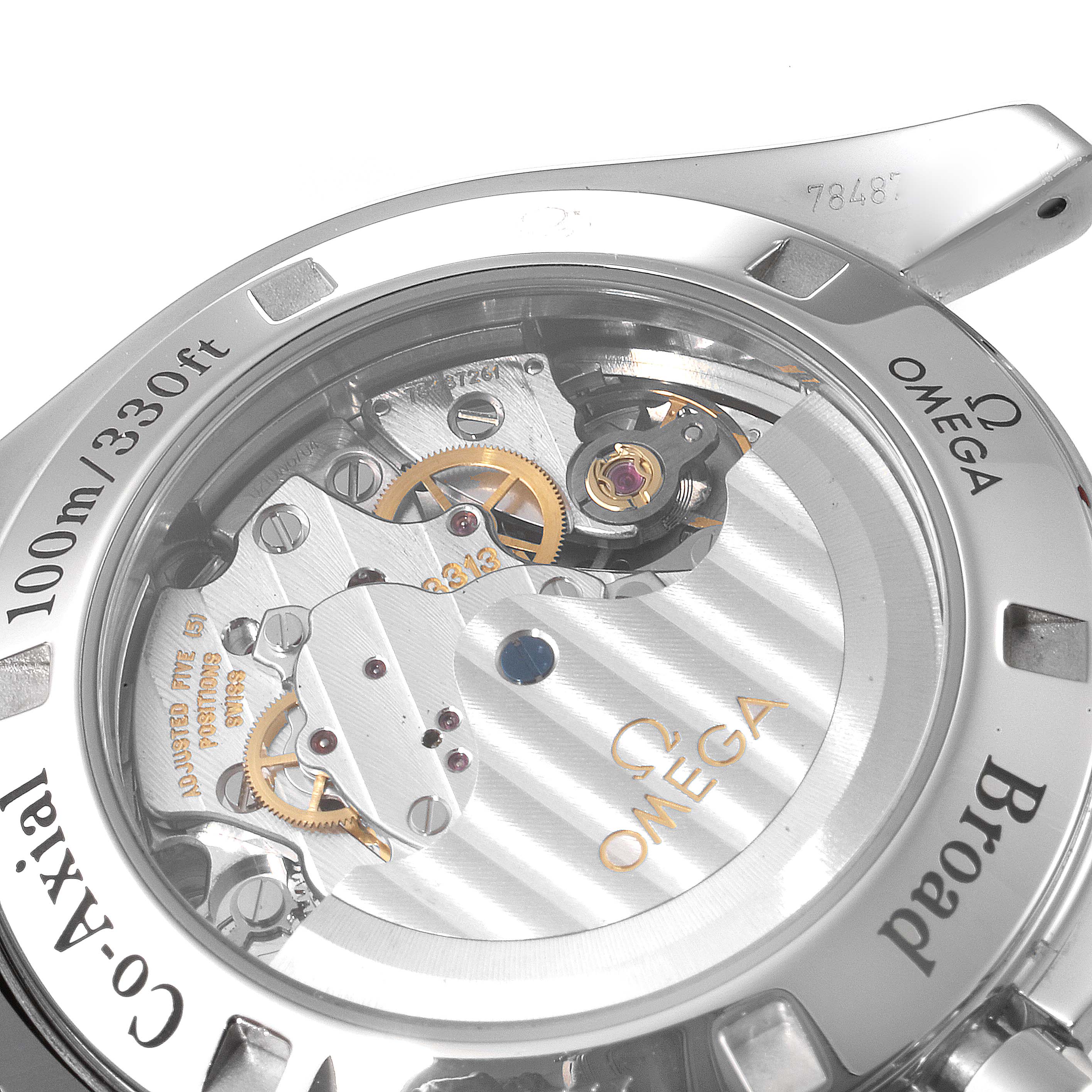 The image shows the back view of the Omega Speedmaster 321.10.42.50.01.001 Men
s Stainless Steel Black Dial 321.10.42.50.01.001 Men
s Stainless Steel Black Dial watch, revealing its co-axial movement and internal mechanics.