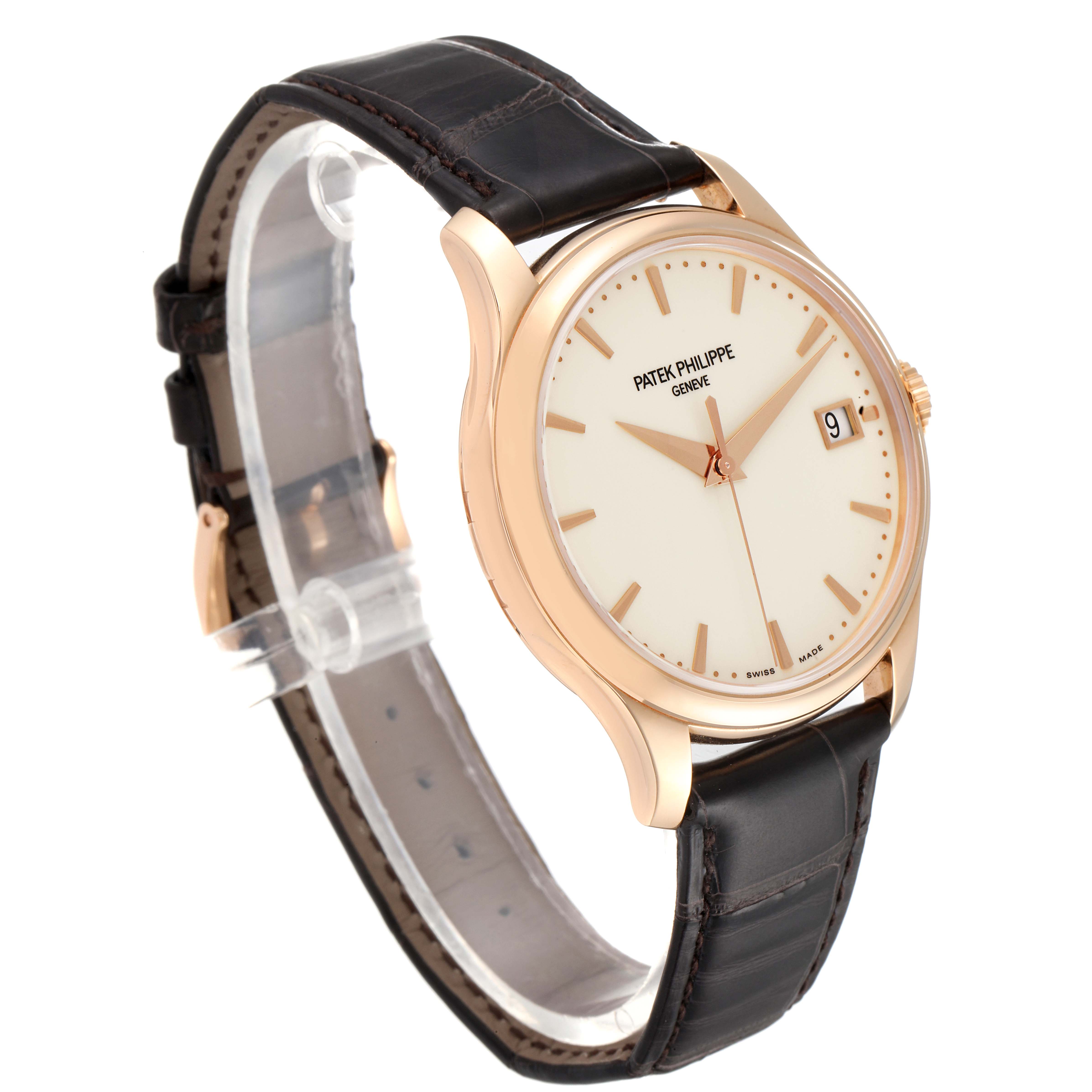 This image shows the Patek Philippe Calatrava 5227R-001 Men's Rose Gold Beige Dial 5227R-001 Men's Rose Gold Beige Dial watch at an angle highlighting the face, side, and leather strap.