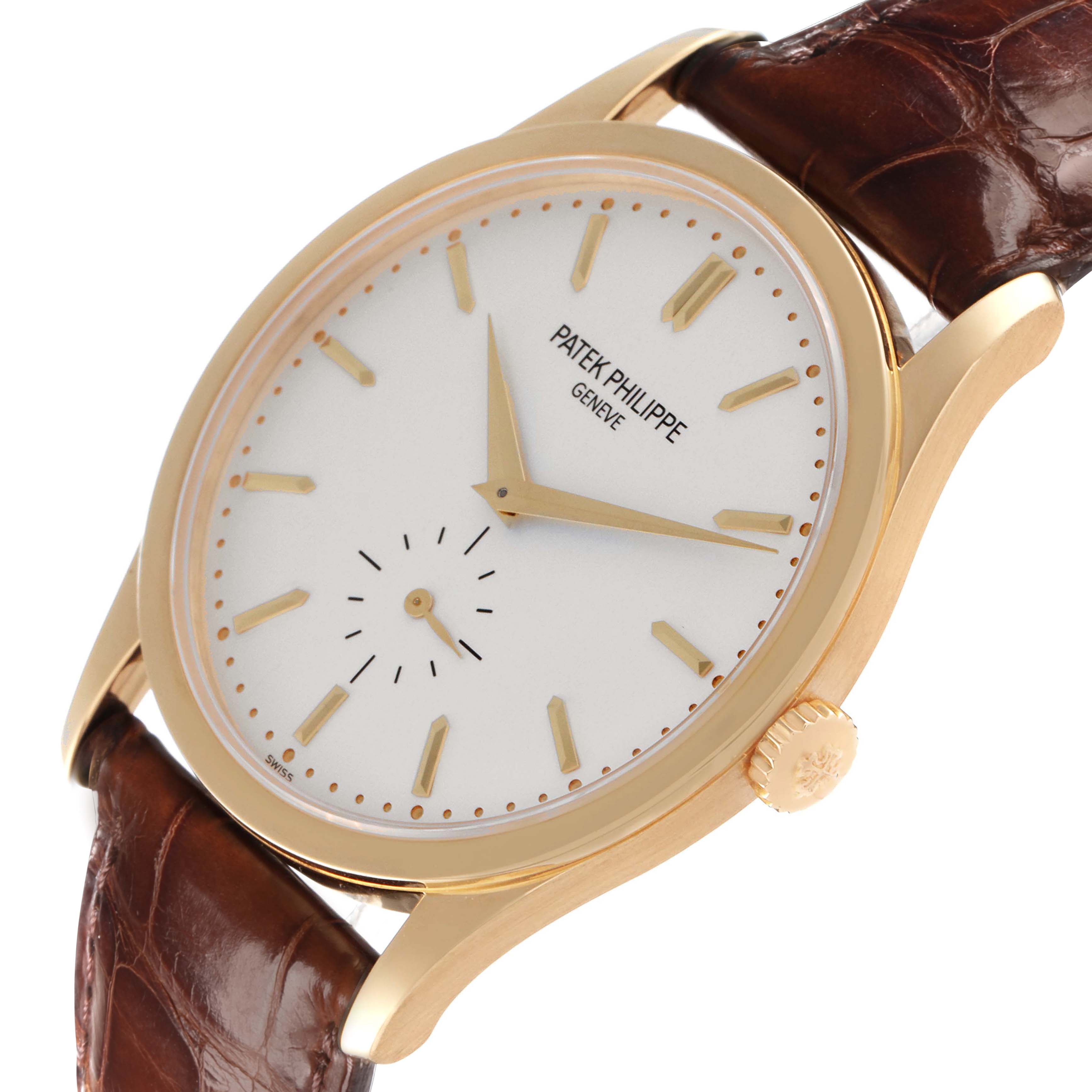 The Patek Philippe Calatrava 5196J watch is shown at an angled view, highlighting its yellow gold case, silver dial, and brown leather strap.