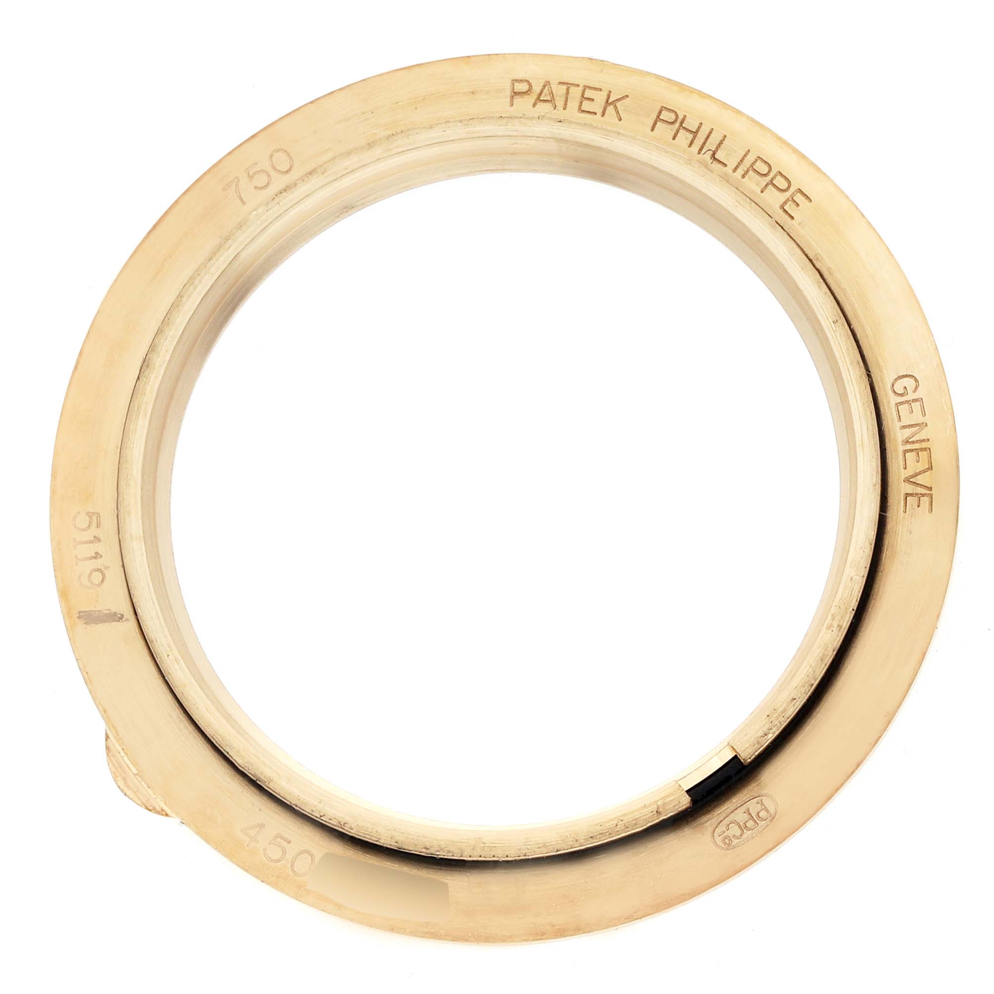 This image shows the bezel of a Patek Philippe Calatrava 5119J-001 Men
s Yellow Gold White Dial model, viewed from above.