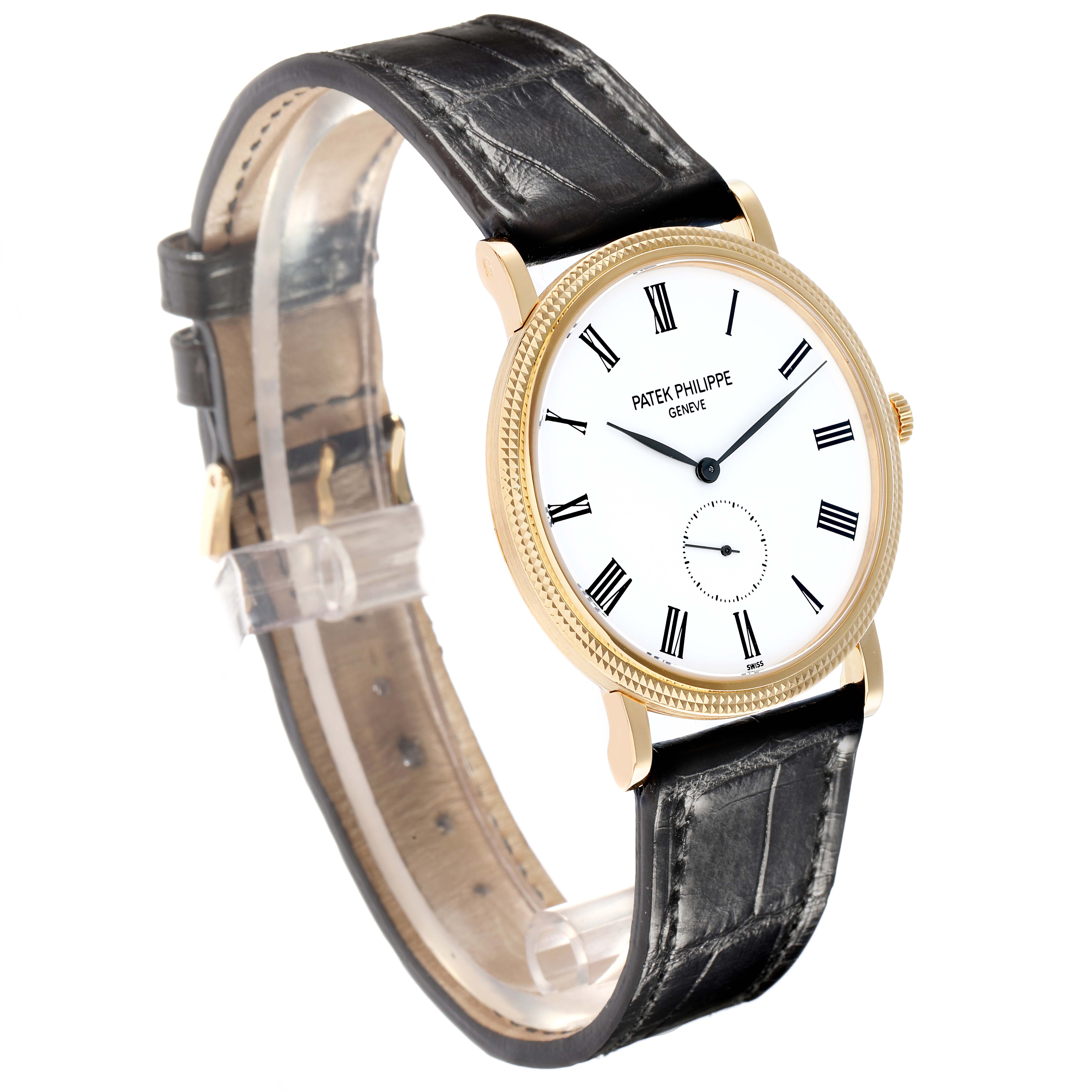The Patek Philippe Calatrava 5119J-001 Men
s Yellow Gold White Dial watch is shown at a slight angle, displaying its face, black leather strap, and gold case.