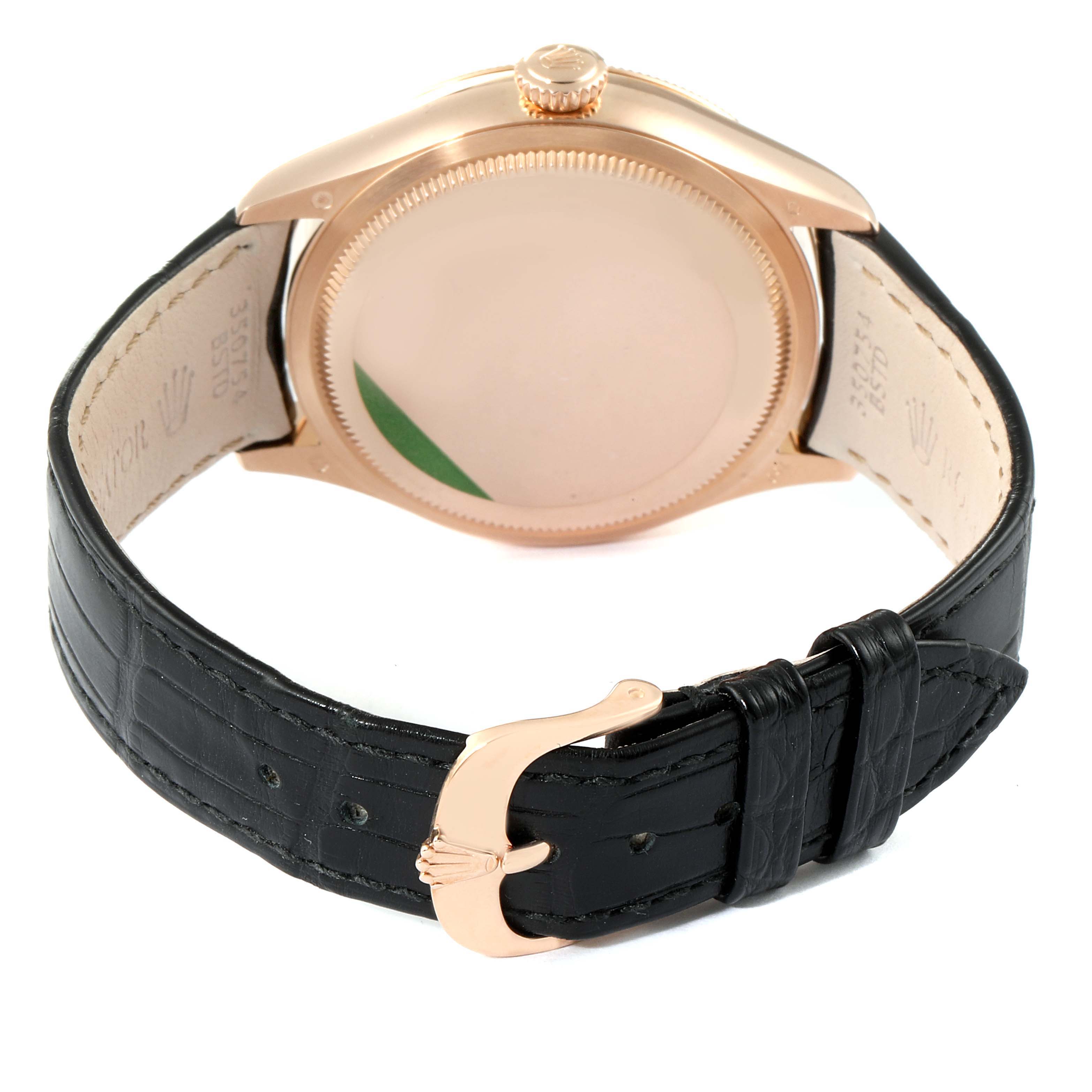 The image shows the back case and strap of a Rolex Cellini 50515 Men's Rose Gold Black Dial 50515 Men's Rose Gold Black Dial watch, showcasing the gold case and black leather strap with a gold buckle.