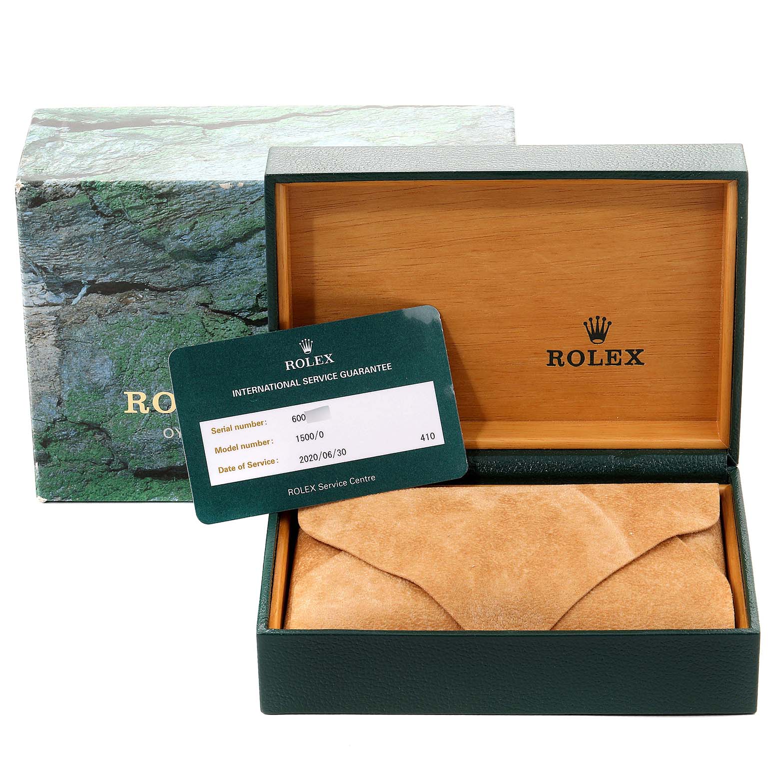 The Vintage Collection Rolex watch's packaging, including the box and international service guarantee card, is shown from a slightly high angle.