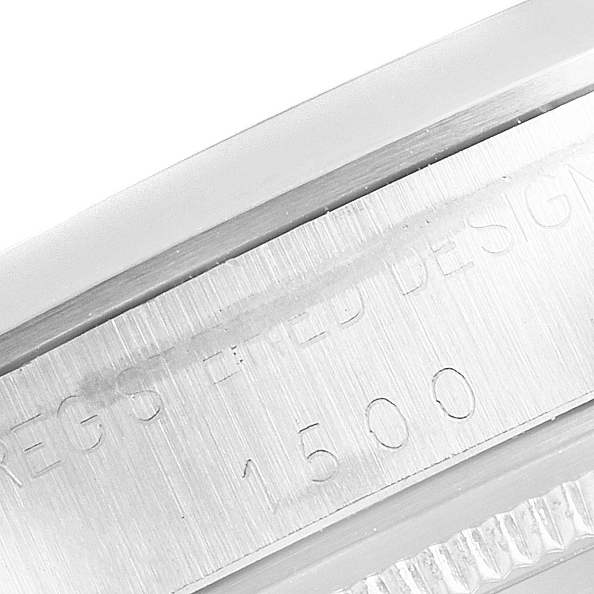The image shows a close-up of the side case of the Rolex Vintage Collection 1500 Men's Stainless Steel Silver Dial 1500 Men's Stainless Steel Silver Dial watch, highlighting the serial number engraving.