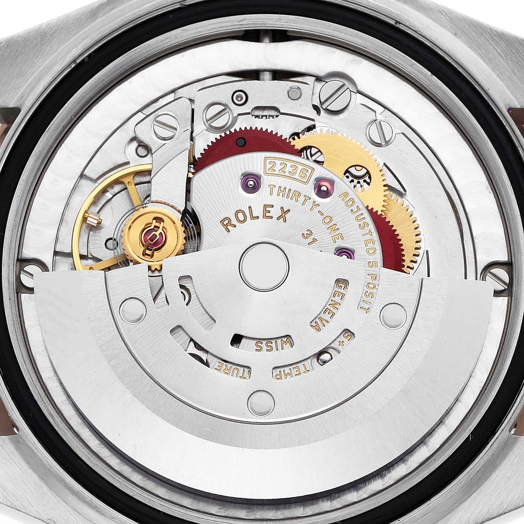 The image shows a detailed view of the Rolex Mid-Size 278341 Women
s Steel and Gold (two tone) Mother of Pearl Dial model
s movement, displaying gears and components from the back.
