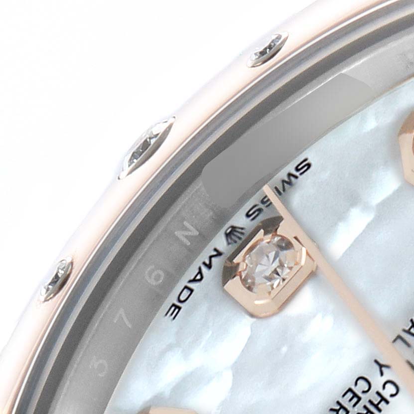 The image shows a close-up of the Rolex Mid-Size 278341 Women
s Steel and Gold (two tone) Mother of Pearl Dial watch face from an oblique angle, highlighting the dial, indices, and part of the bezel.