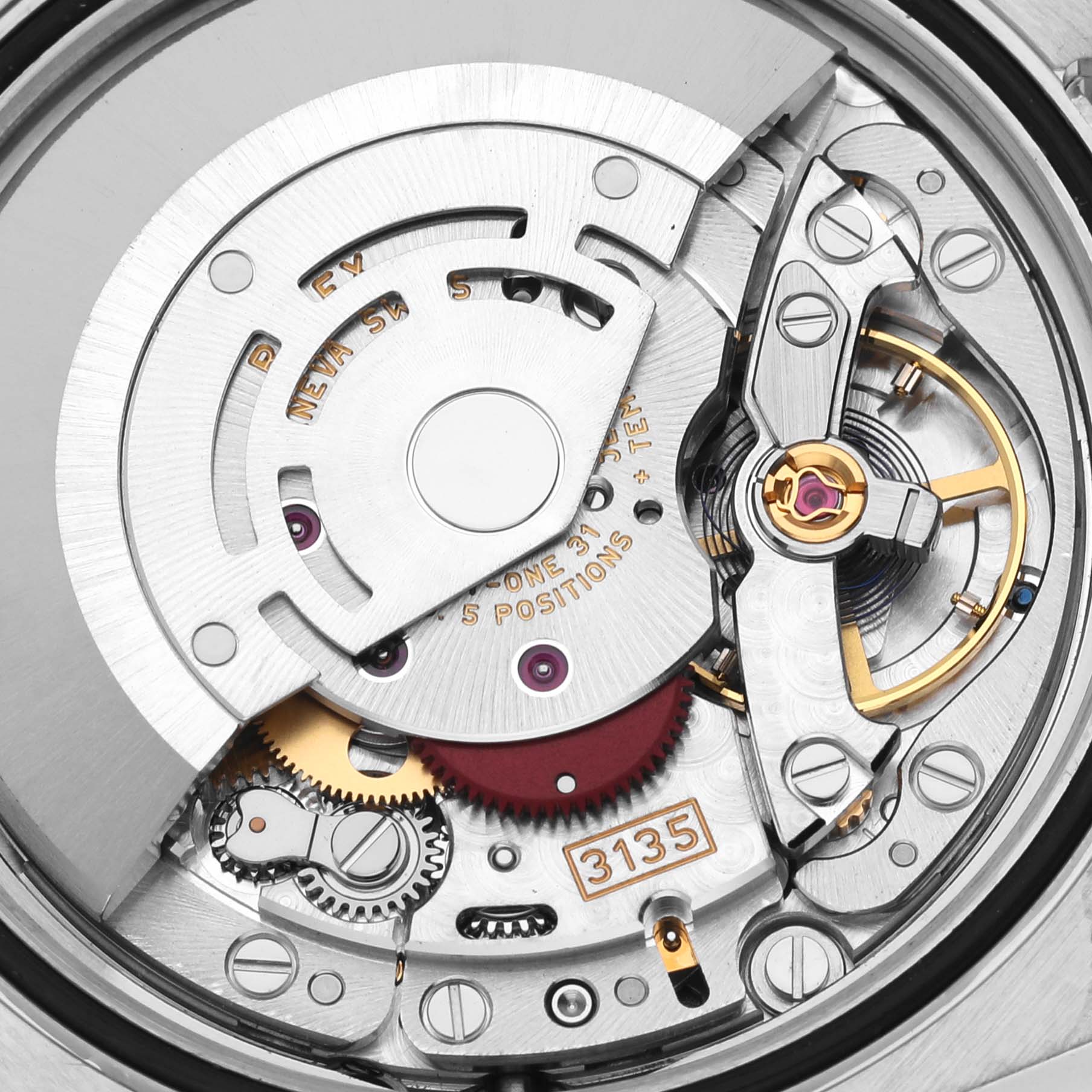 This image shows the internal movement mechanism of the Rolex Datejust 116244 Men's Stainless Steel Brown Dial 116244 Men's Stainless Steel Brown Dial, including gears, rotors, and the balance wheel.